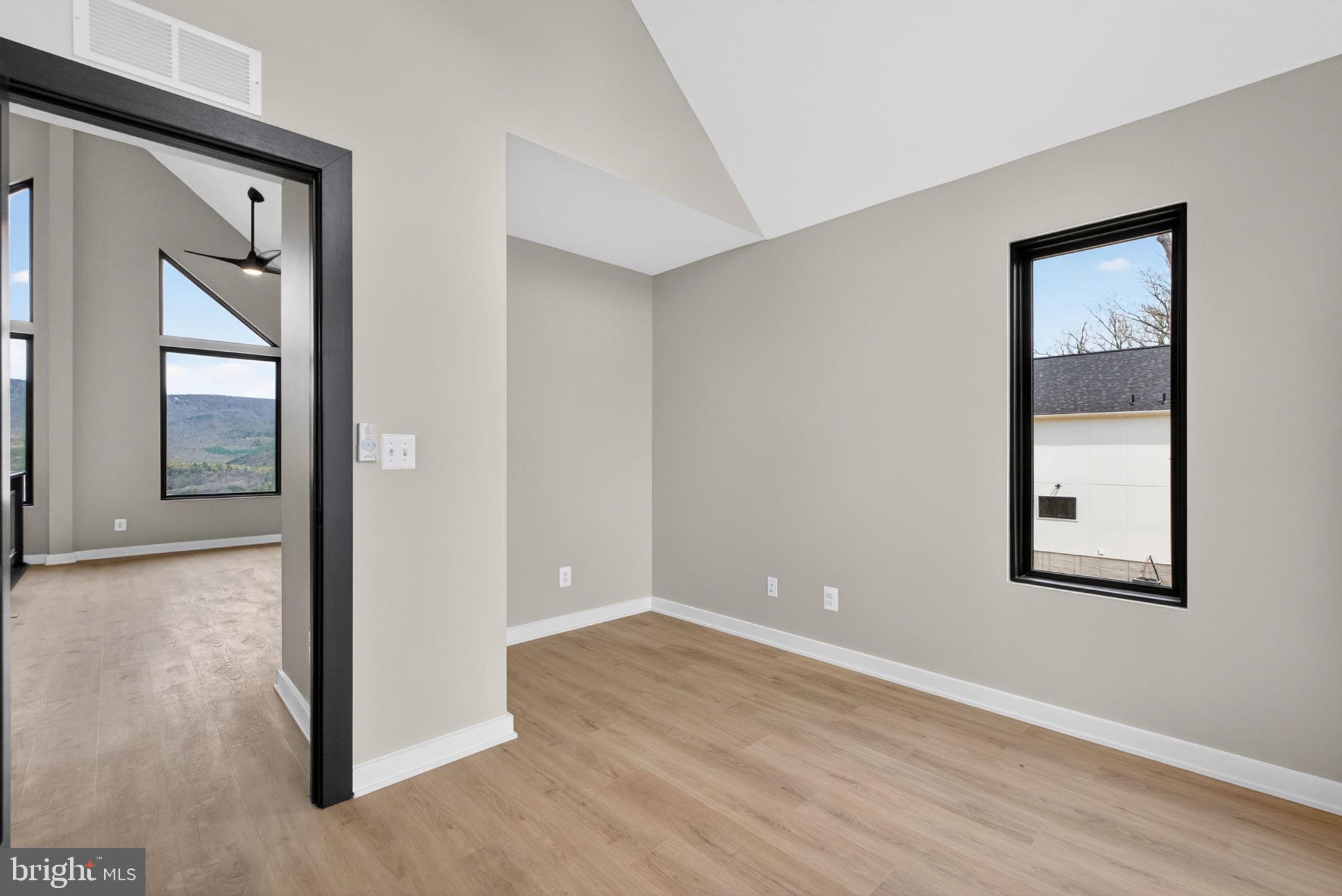 4101 Supinlick Ridge Road Mount Jackson, VA 22842 - Photo 23 of 34 an empty room with wooden floor and windows