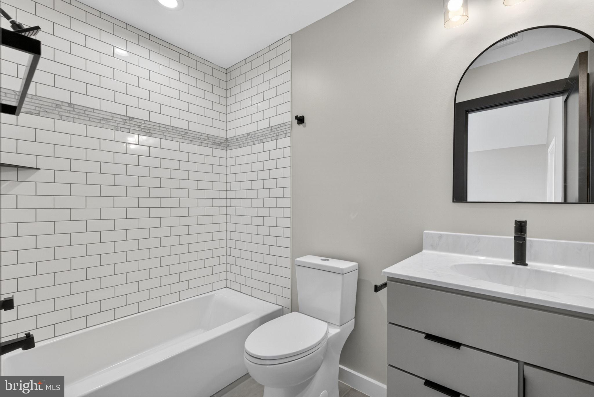 4101 Supinlick Ridge Road Mount Jackson, VA 22842 - Photo 24 of 34 a bathroom with a toilet sink vanity tub and mirror