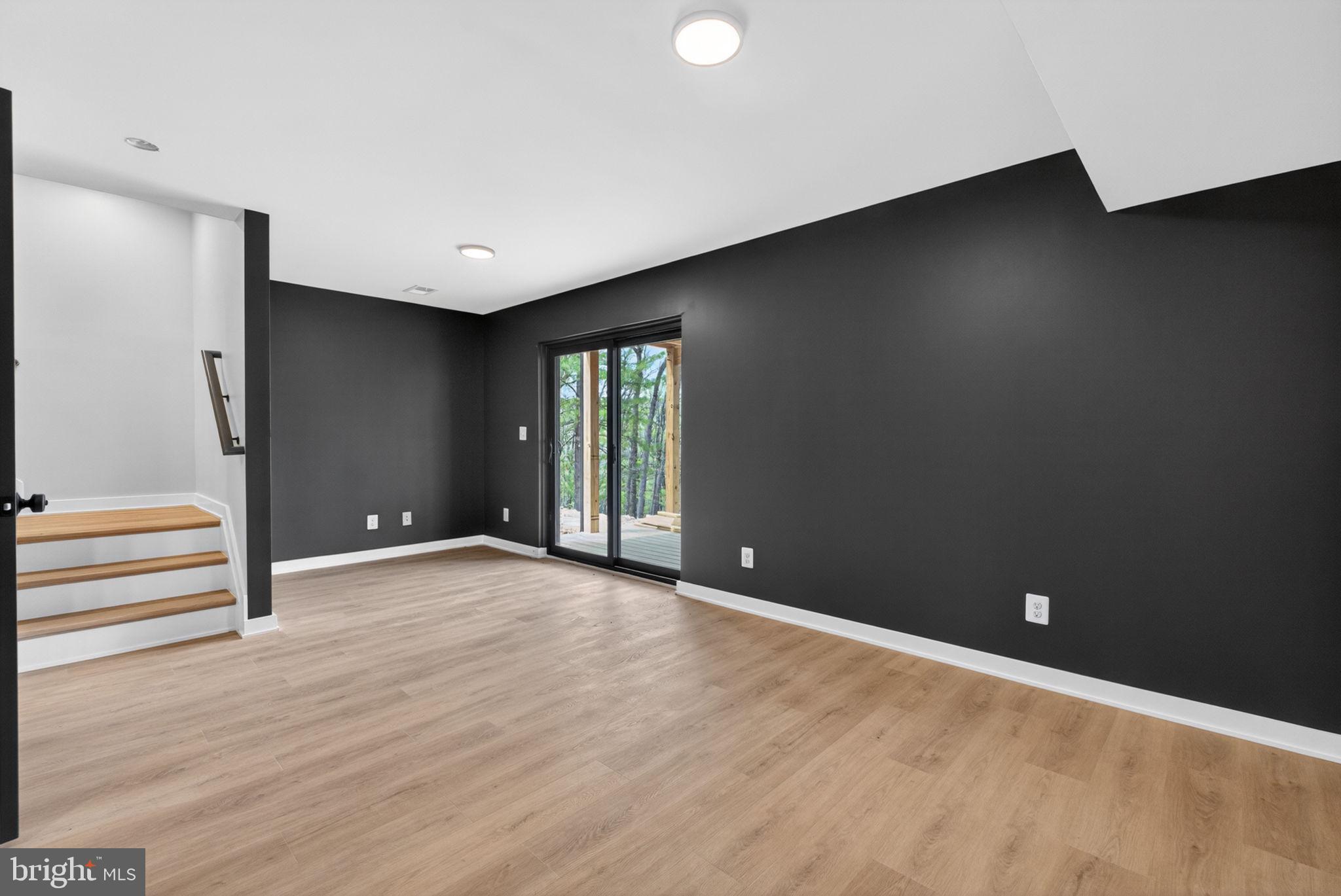 4101 Supinlick Ridge Road Mount Jackson, VA 22842 - Photo 29 of 34 a view of an empty room with wooden floor and a window