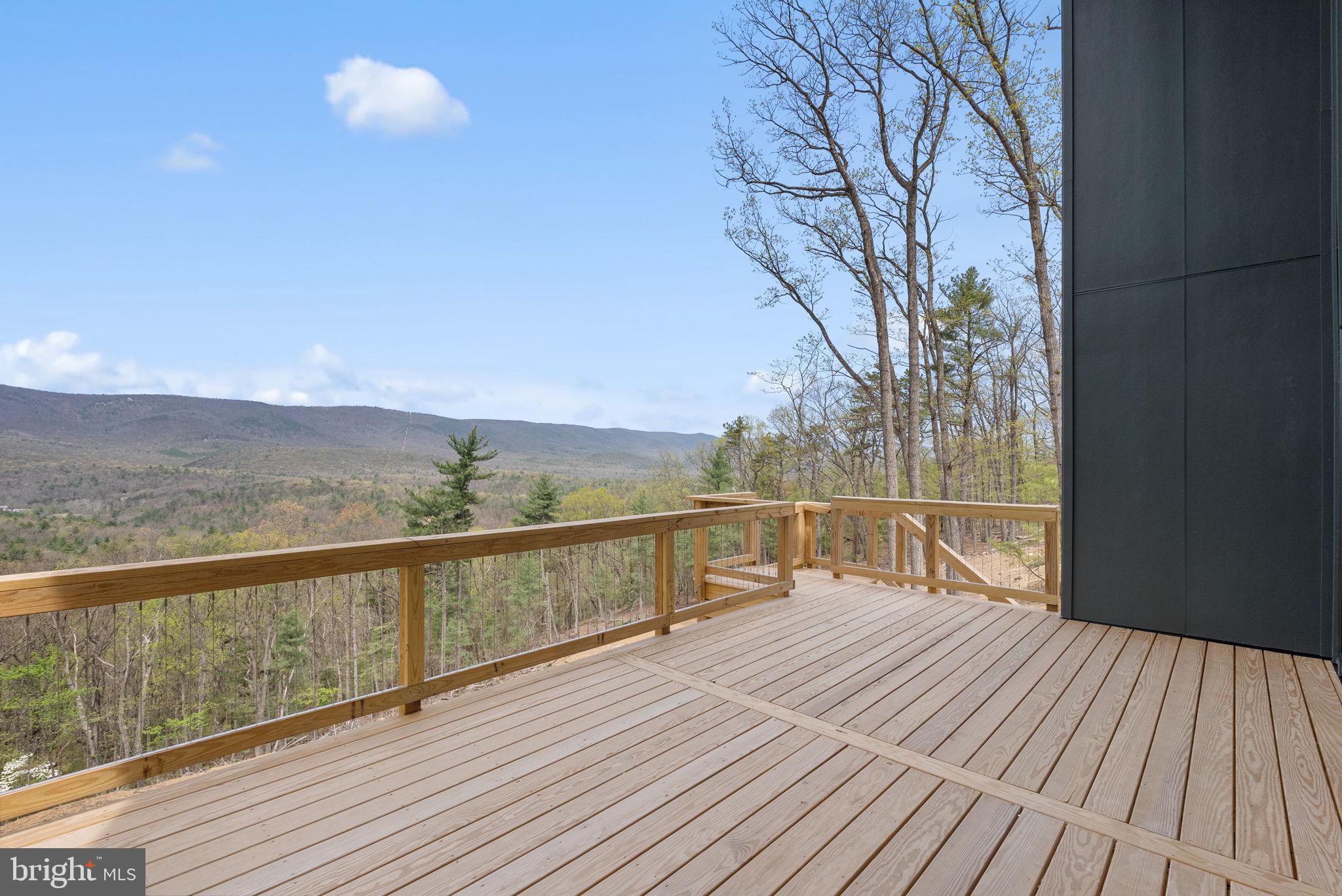 4101 Supinlick Ridge Road Mount Jackson, VA 22842 - Photo 4 of 34 a view of balcony with wooden floor and fence