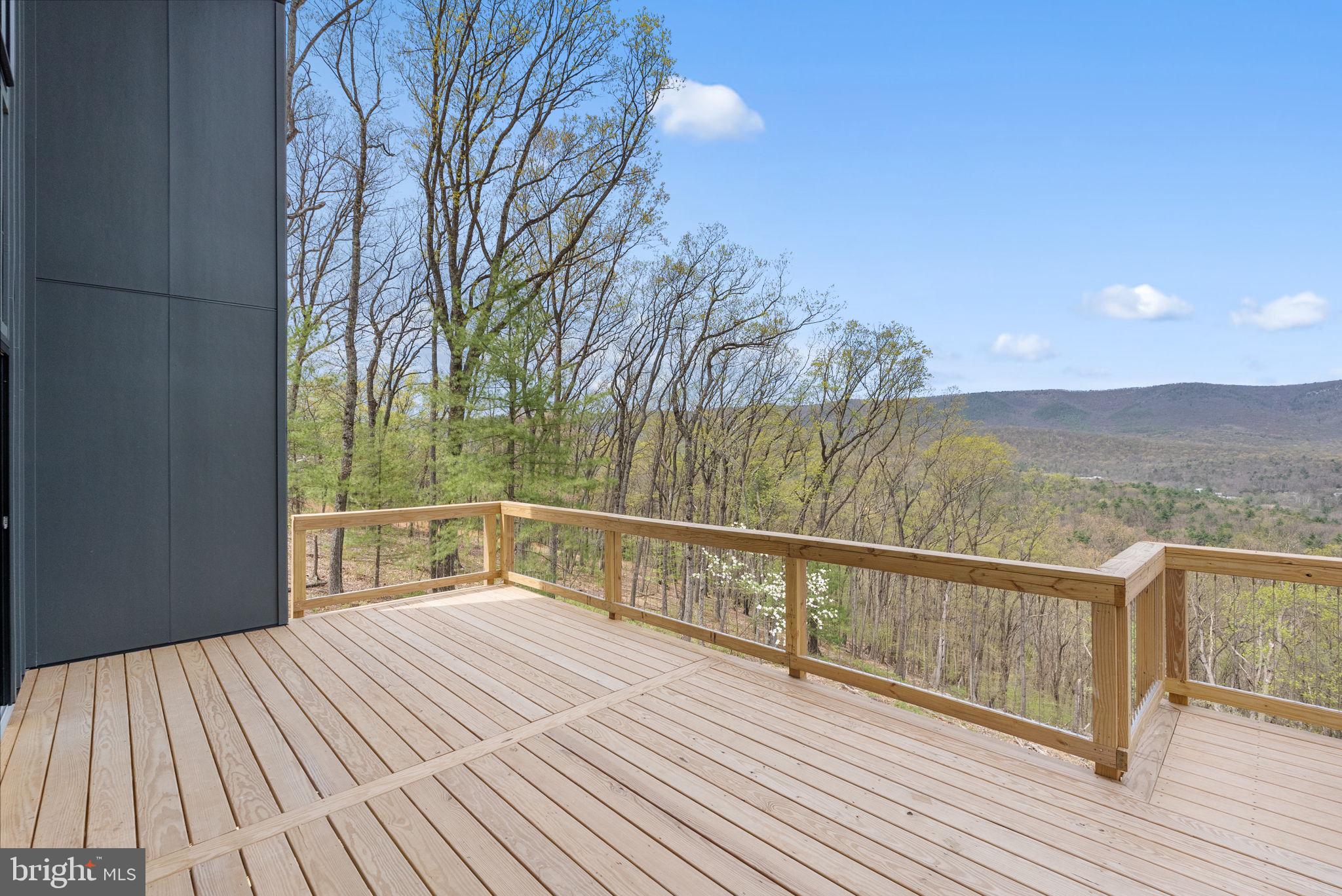 4101 Supinlick Ridge Road Mount Jackson, VA 22842 - Photo 5 of 34 a view of a balcony with wooden floor and fence