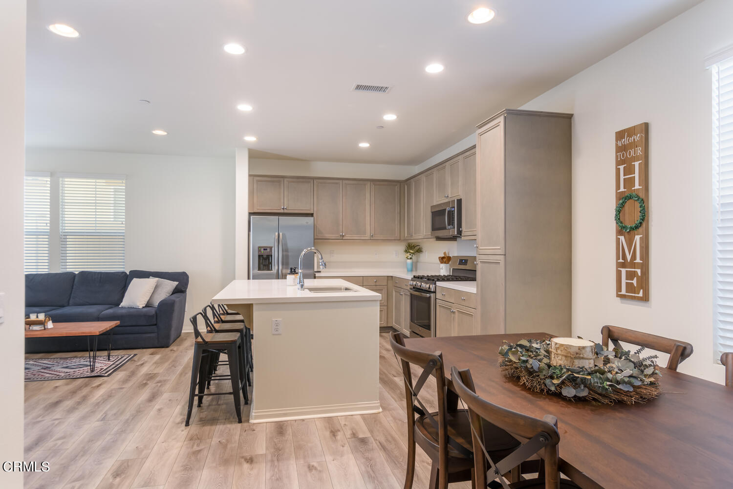 217 Stonegate Road Camarillo, CA 93010 - Photo 6 of 33 a living room with stainless steel appliances furniture a dining table and kitchen view