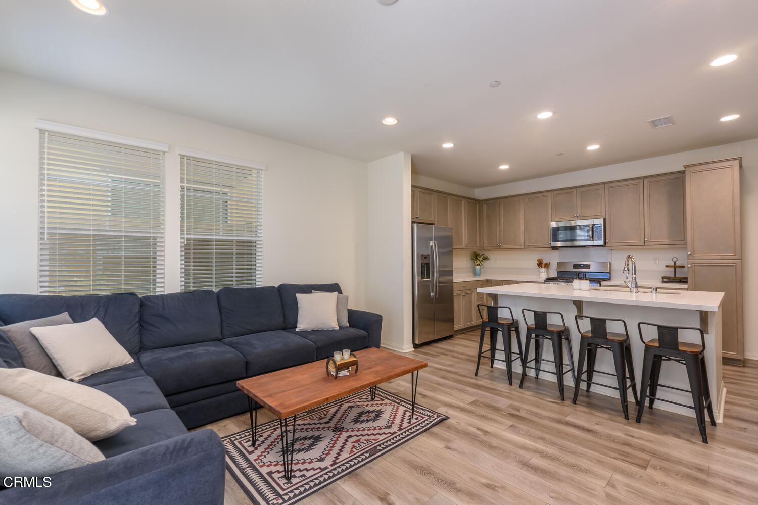 217 Stonegate Road Camarillo, CA 93010 - Photo 7 of 33 a living room kitchen with furniture and a dining table with kitchen view