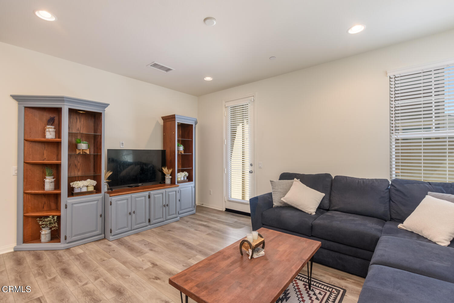 217 Stonegate Road Camarillo, CA 93010 - Photo 8 of 33 a living room with furniture and a flat screen tv