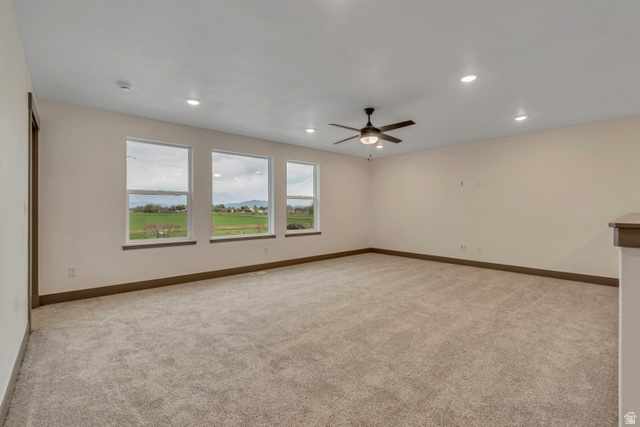 3317 South 1000 West, Unit 6010 Logan, UT 84321 - Photo 22 of 34 Unfurnished room featuring light colored carpet, a ceiling fan, and recessed lighting