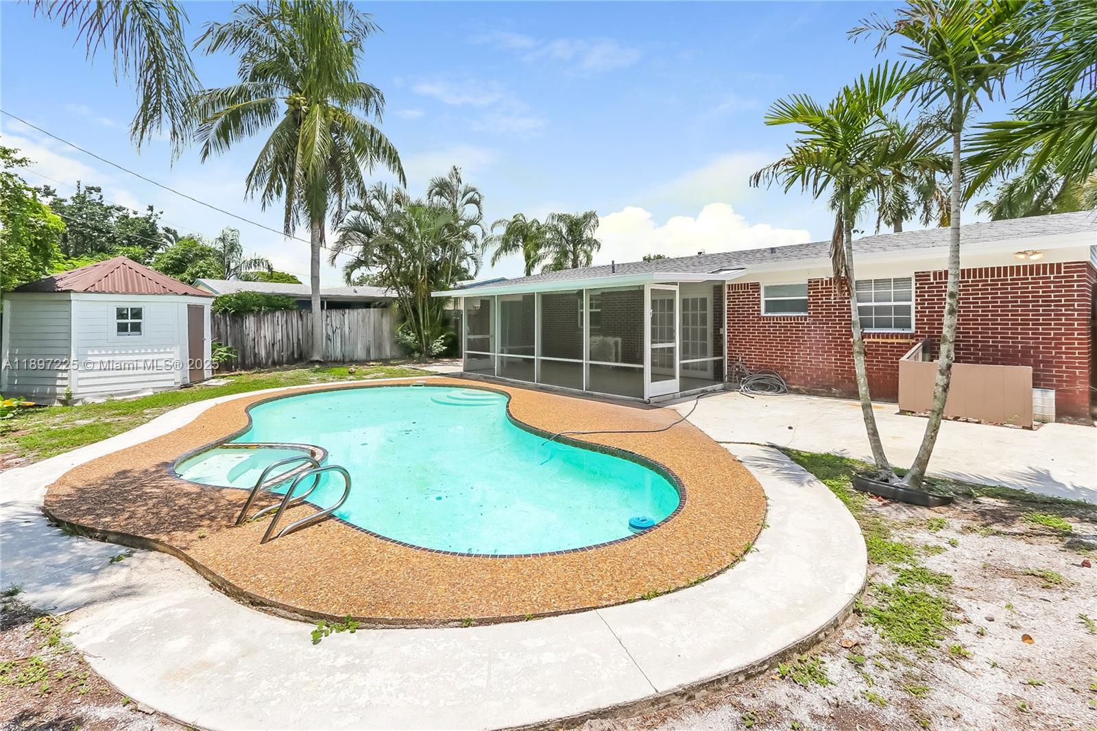 3626 Everglades Road Palm Beach Gardens, FL 33410 - Photo 14 of 16 front view of a house with swimming pool