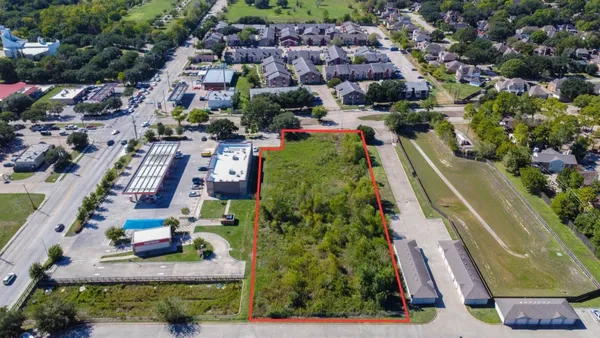 an aerial view of a city with lots of residential buildings