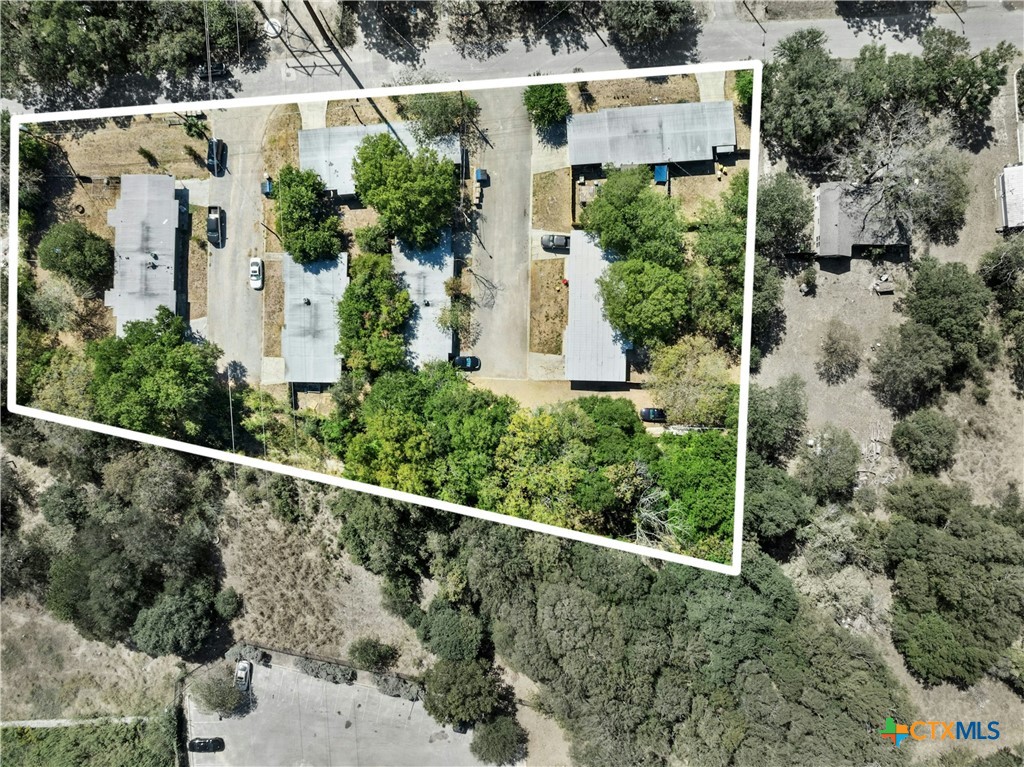 an aerial view of house with yard