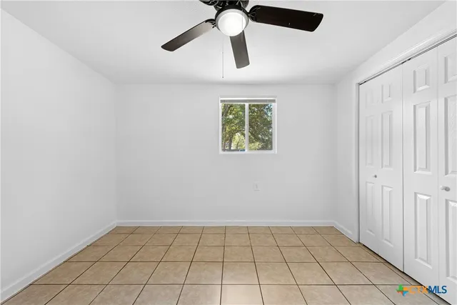 a view of an empty room and window