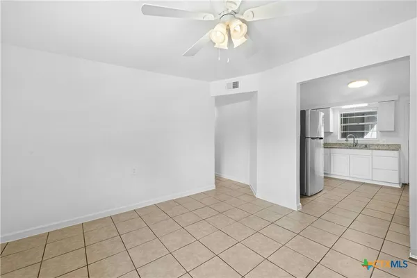 a view of a kitchen with a sink