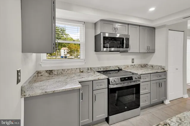 a kitchen with a stove and a sink