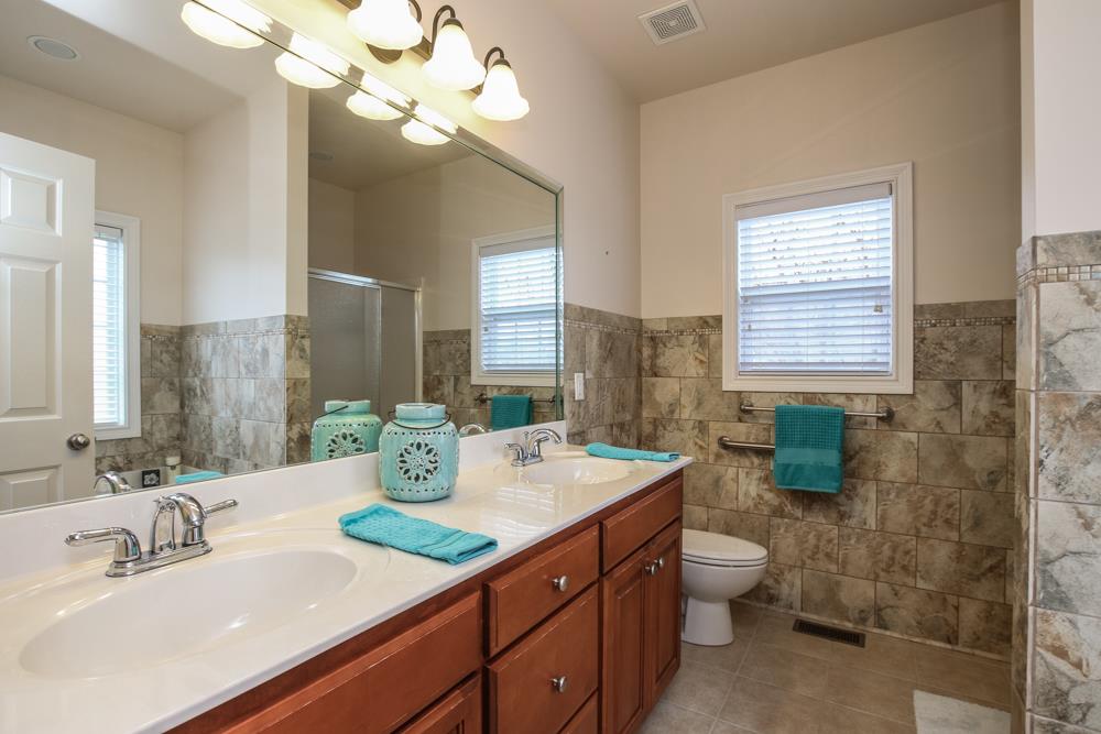 605 Lee Road Lebanon, TN 37087 - Photo 11 of 30 a bathroom with a double vanity sink and a mirror