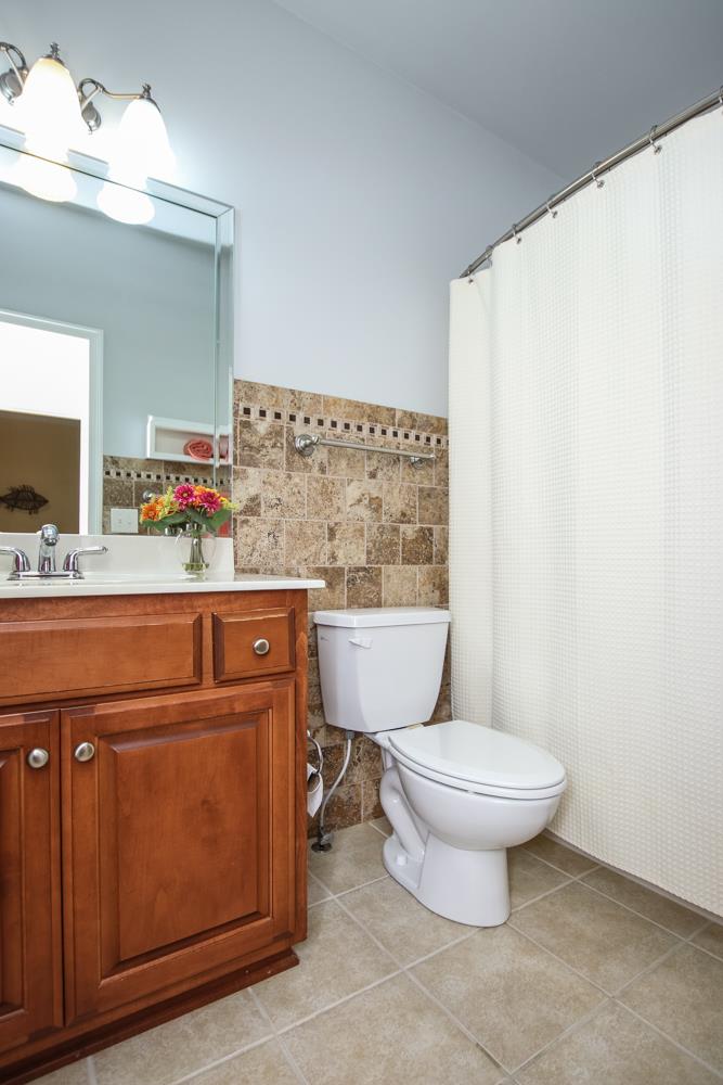 605 Lee Road Lebanon, TN 37087 - Photo 18 of 30 a bathroom with a toilet sink vanity and mirror