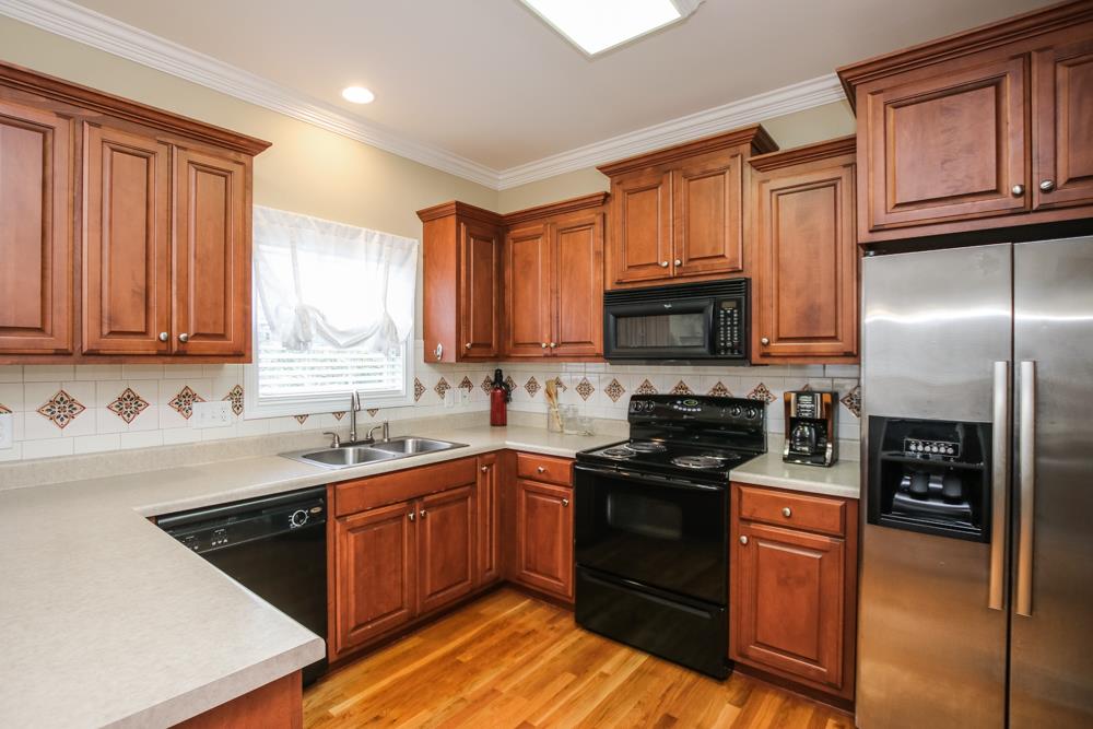 605 Lee Road Lebanon, TN 37087 - Photo 3 of 30 a kitchen with stainless steel appliances granite countertop a stove sink microwave and refrigerator