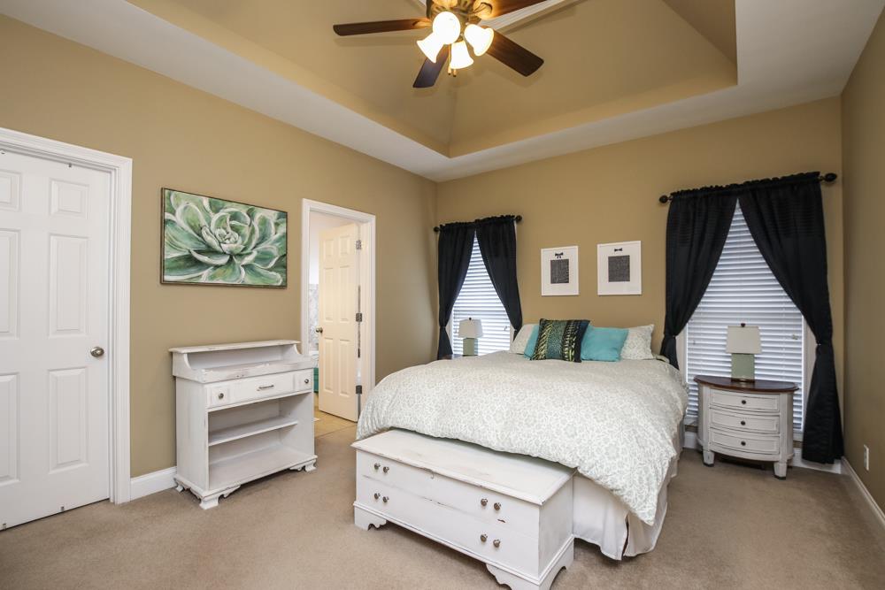 605 Lee Road Lebanon, TN 37087 - Photo 9 of 30 a bedroom with a bed and a chandelier