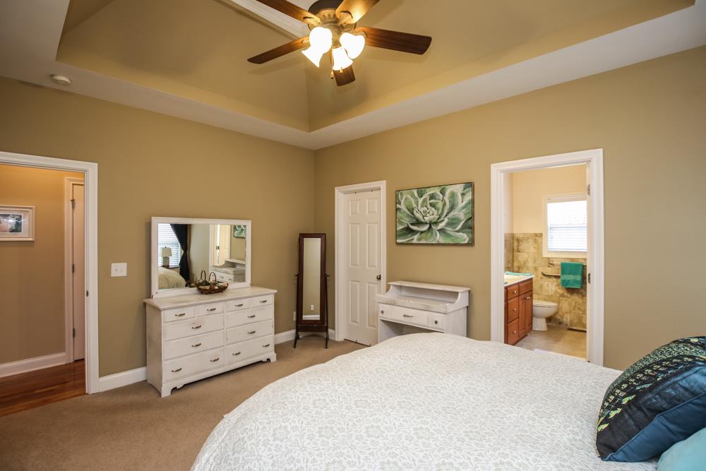 605 Lee Road Lebanon, TN 37087 - Photo 10 of 30 a bedroom with a bed and a chandelier