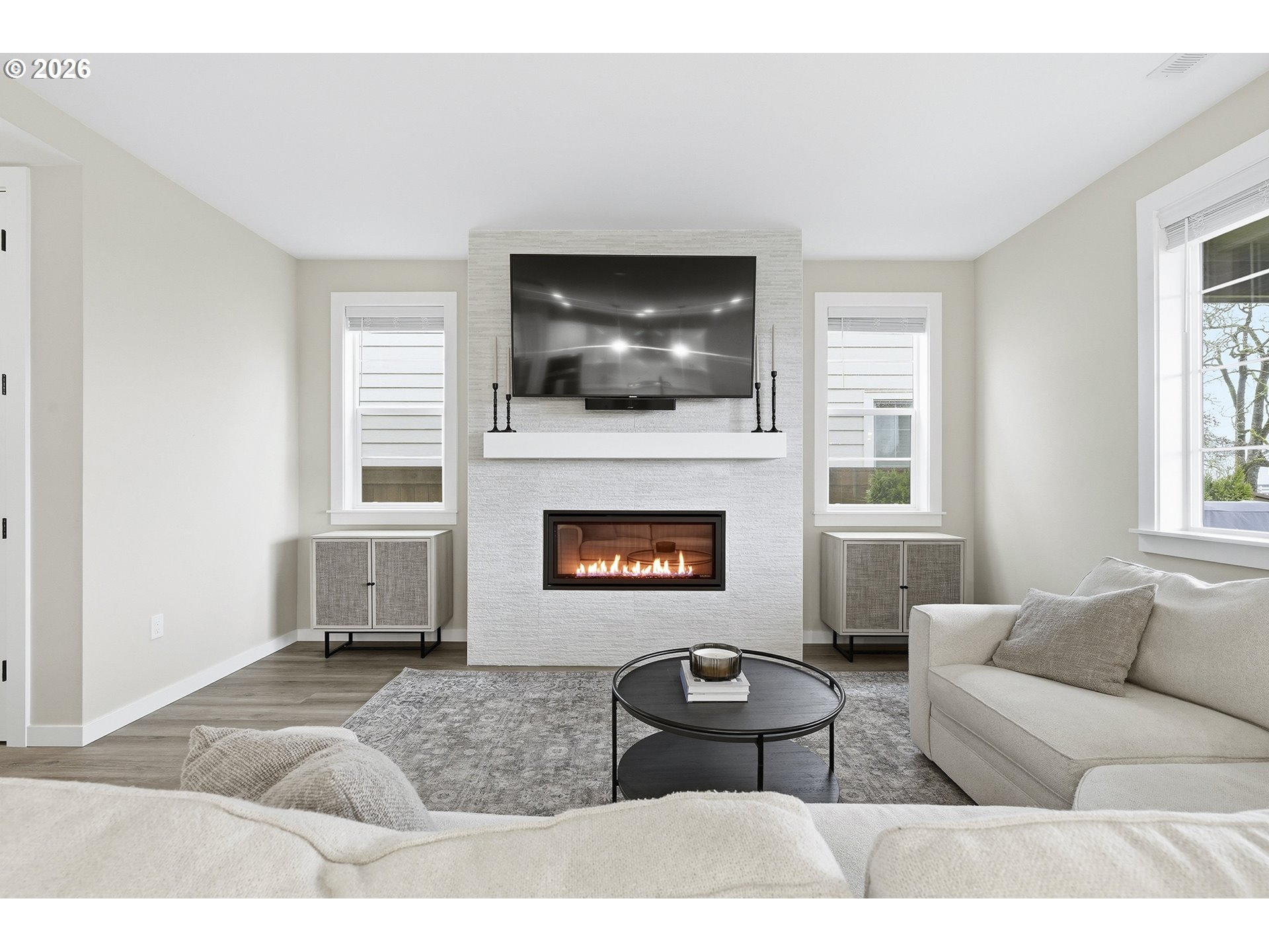 6724 Southwest Lupine Way Wilsonville, OR 97070 - Photo 12 of 45 a living room with furniture and a fireplace