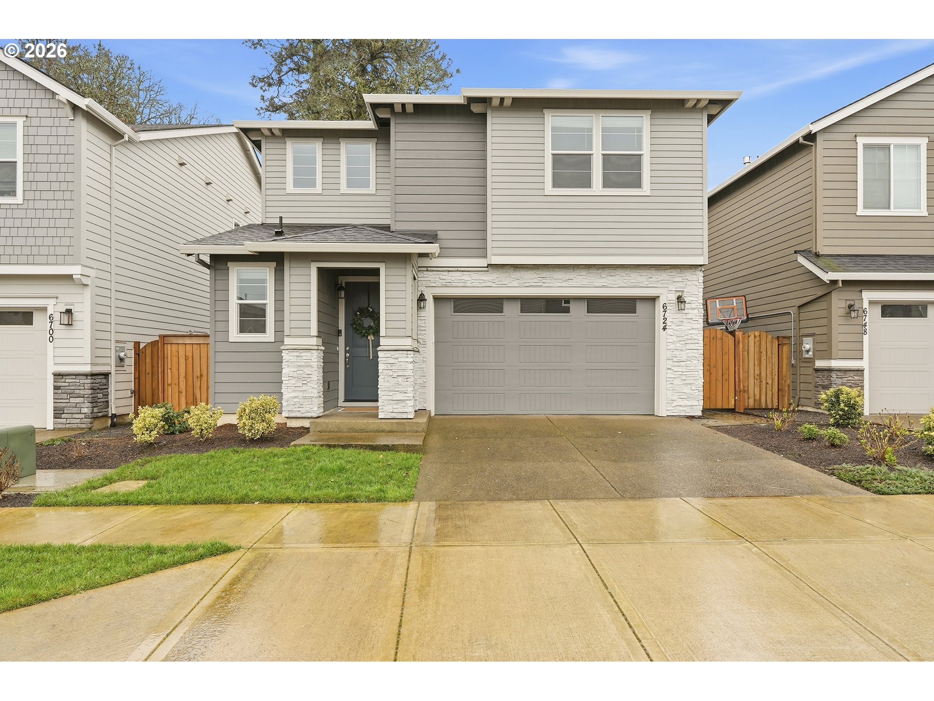 6724 Southwest Lupine Way Wilsonville, OR 97070 - Photo 2 of 45 a view of a yard in front of a house