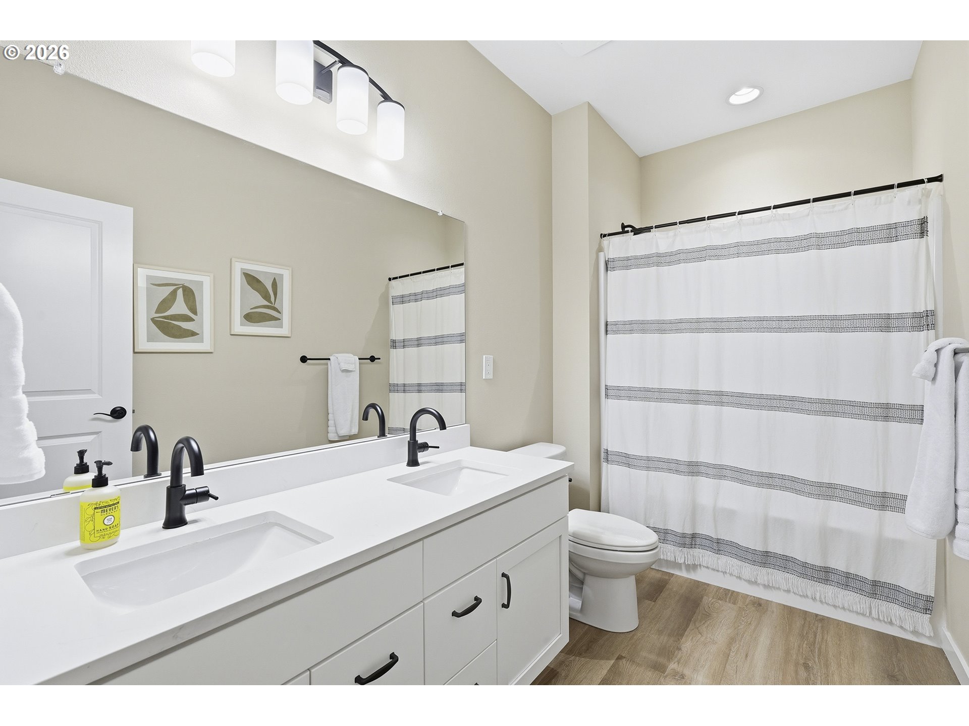 6724 Southwest Lupine Way Wilsonville, OR 97070 - Photo 22 of 45 a bathroom with a sink a toilet and a mirror