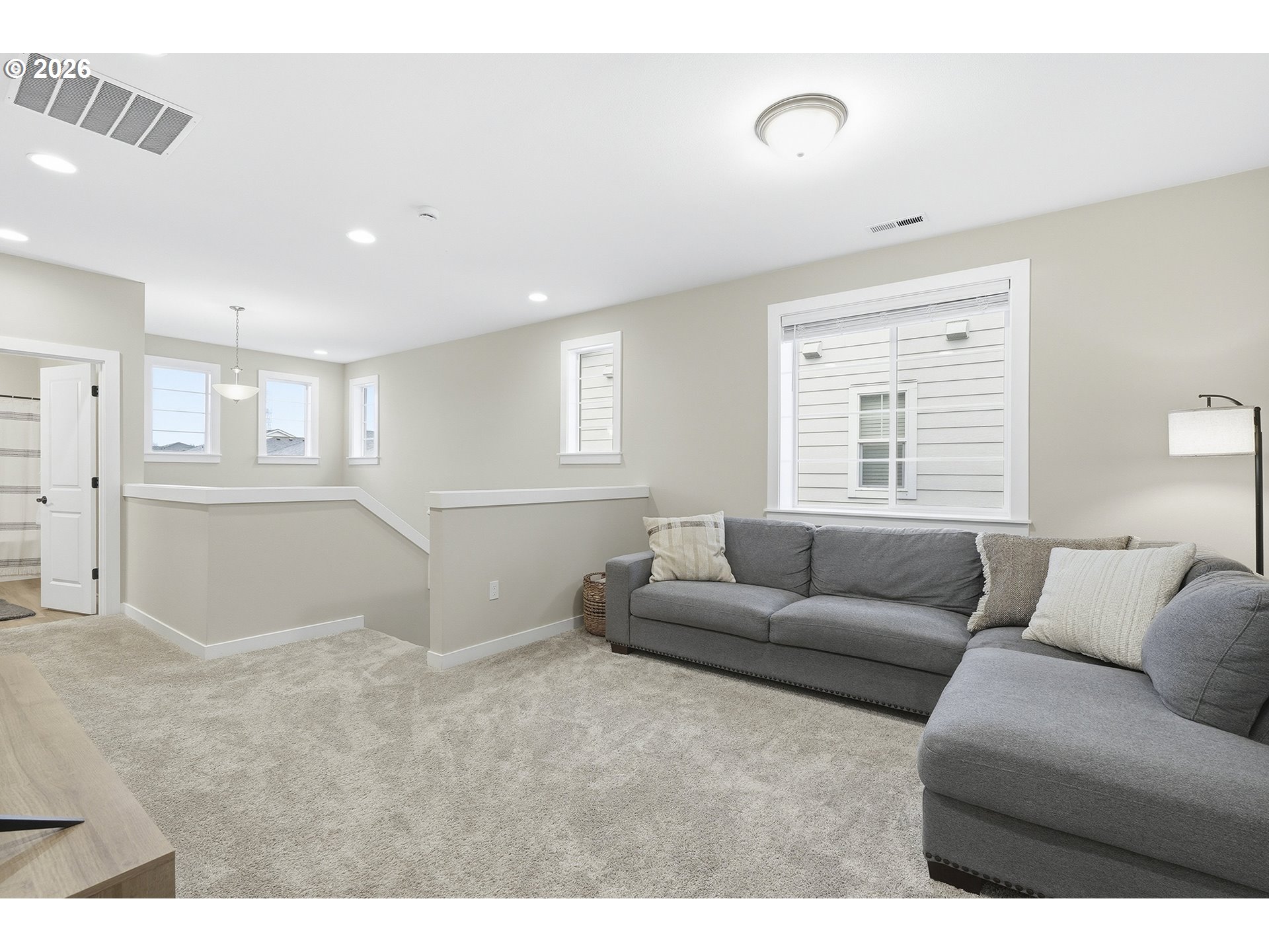6724 Southwest Lupine Way Wilsonville, OR 97070 - Photo 24 of 45 a living room with furniture and a window