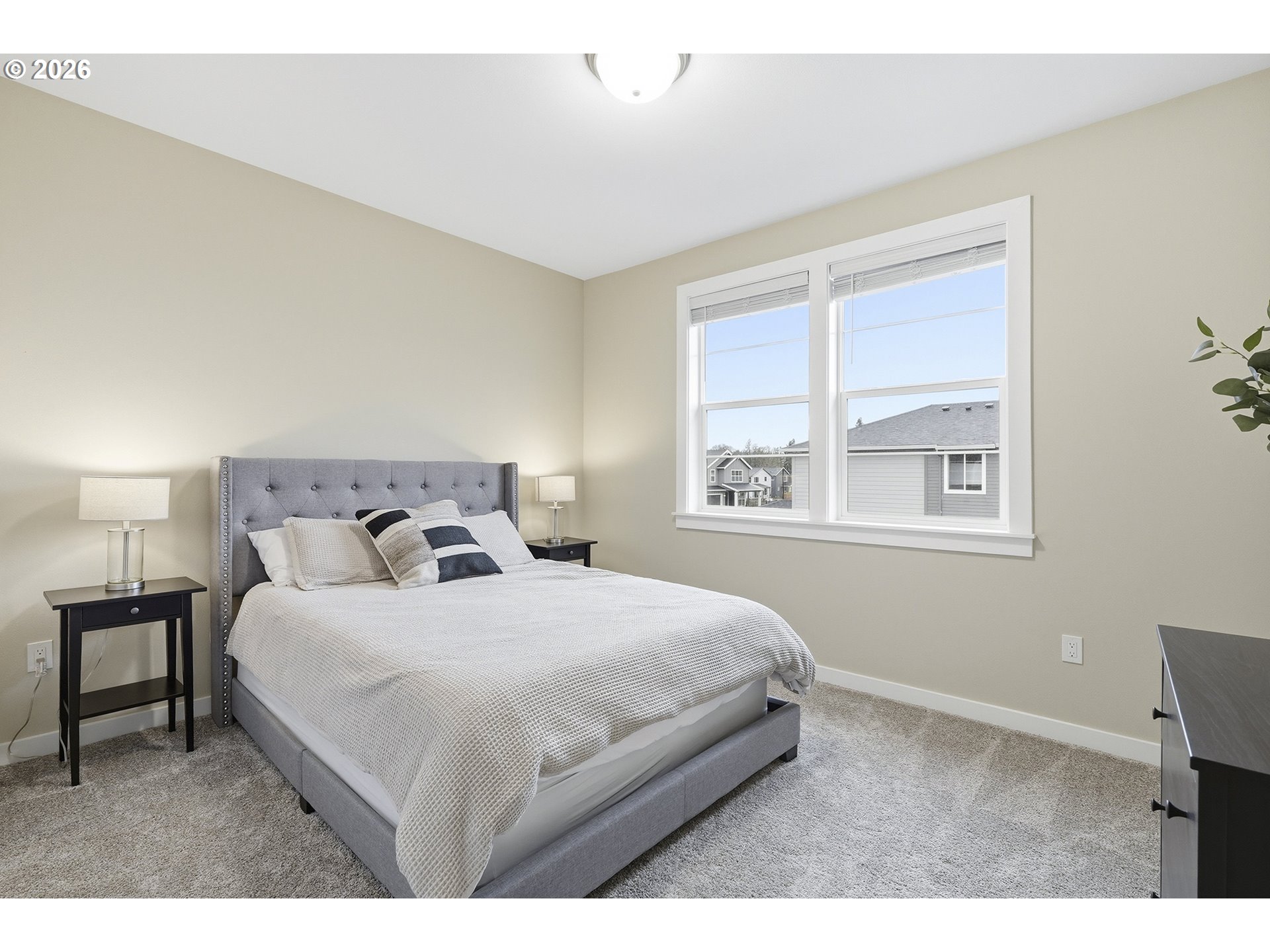 6724 Southwest Lupine Way Wilsonville, OR 97070 - Photo 26 of 45 a bedroom with a bed and a window