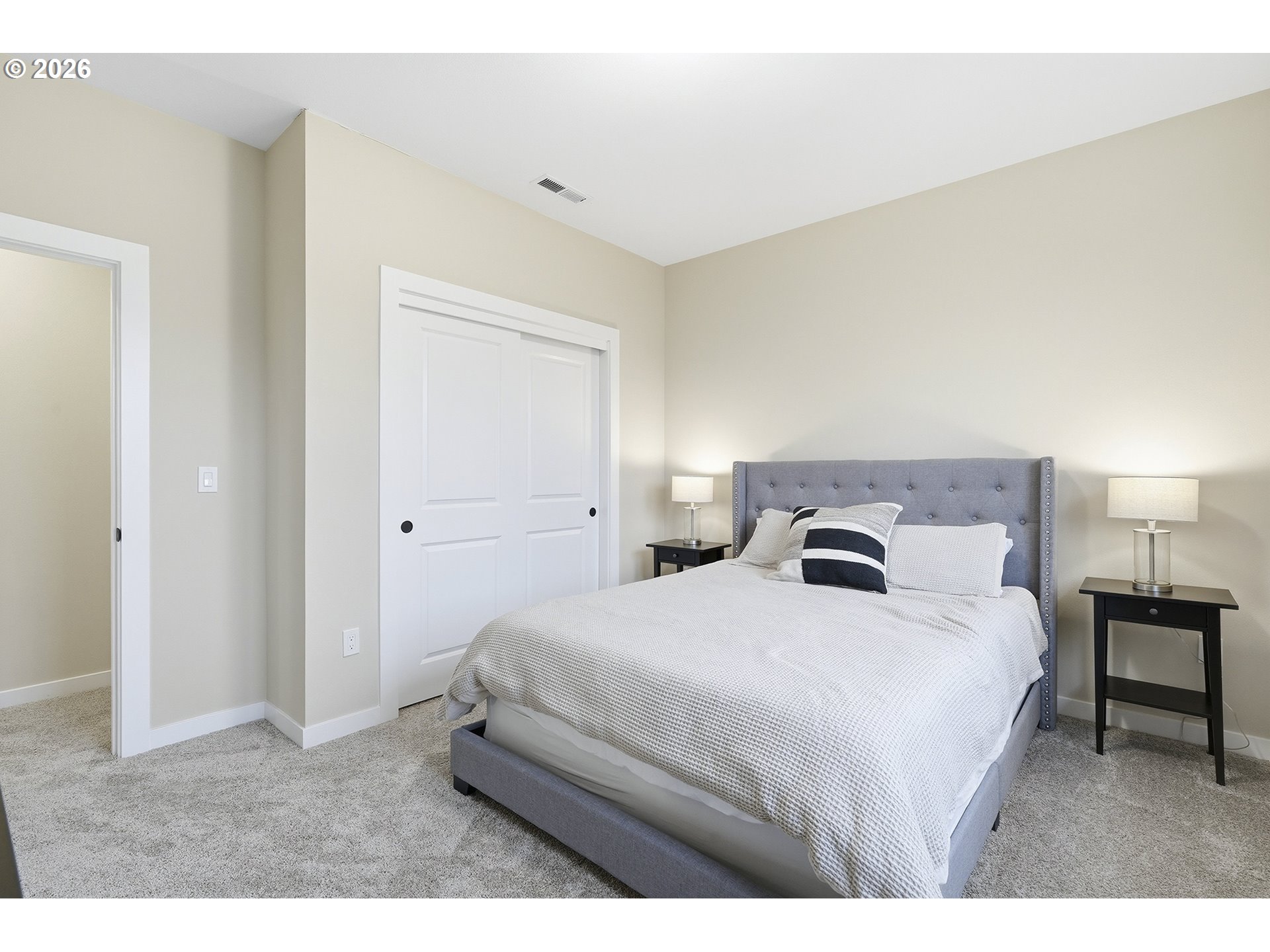 6724 Southwest Lupine Way Wilsonville, OR 97070 - Photo 27 of 45 a bedroom with a bed and a table