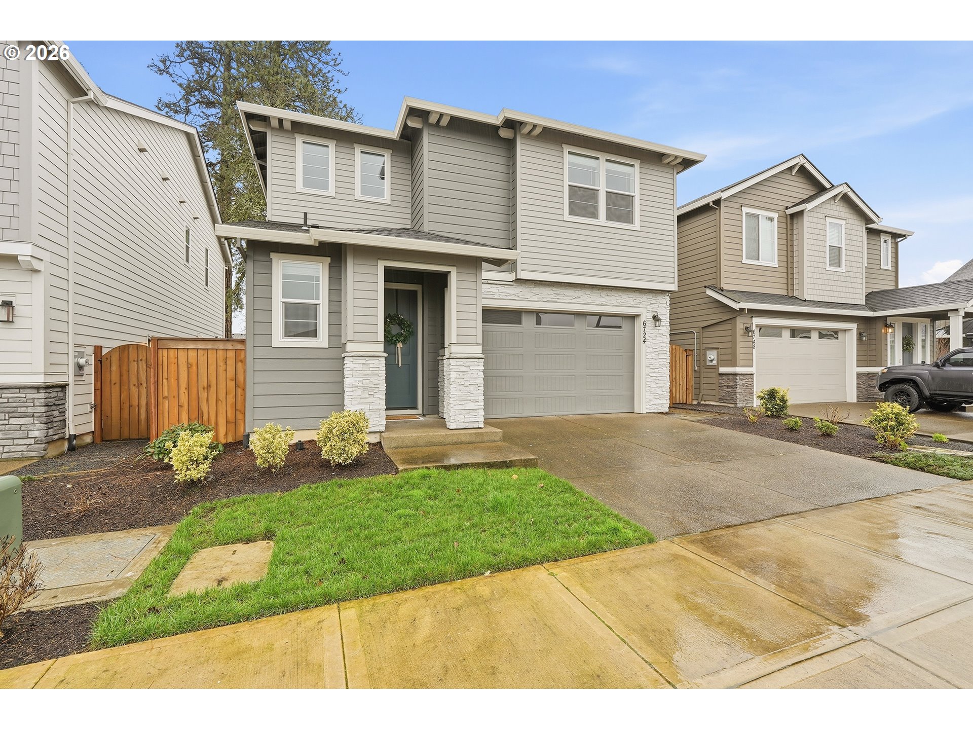 6724 Southwest Lupine Way Wilsonville, OR 97070 - Photo 3 of 45 a front view of a house with a yard