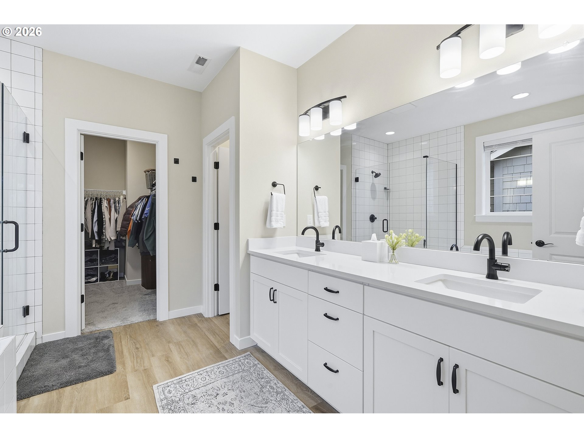 6724 Southwest Lupine Way Wilsonville, OR 97070 - Photo 33 of 45 a bathroom with a sink a mirror a vanity and shower