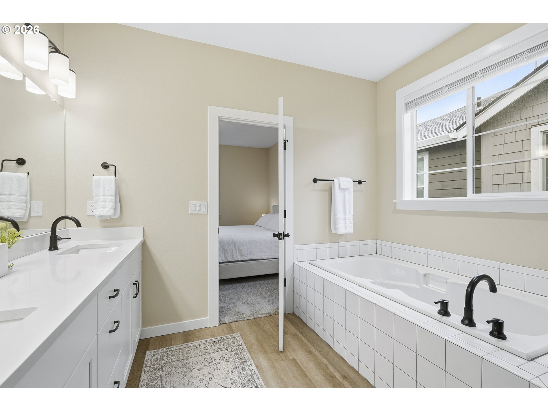 6724 Southwest Lupine Way Wilsonville, OR 97070 - Photo 35 of 45 a en suite bathroom with a granite countertop tub sink and mirror