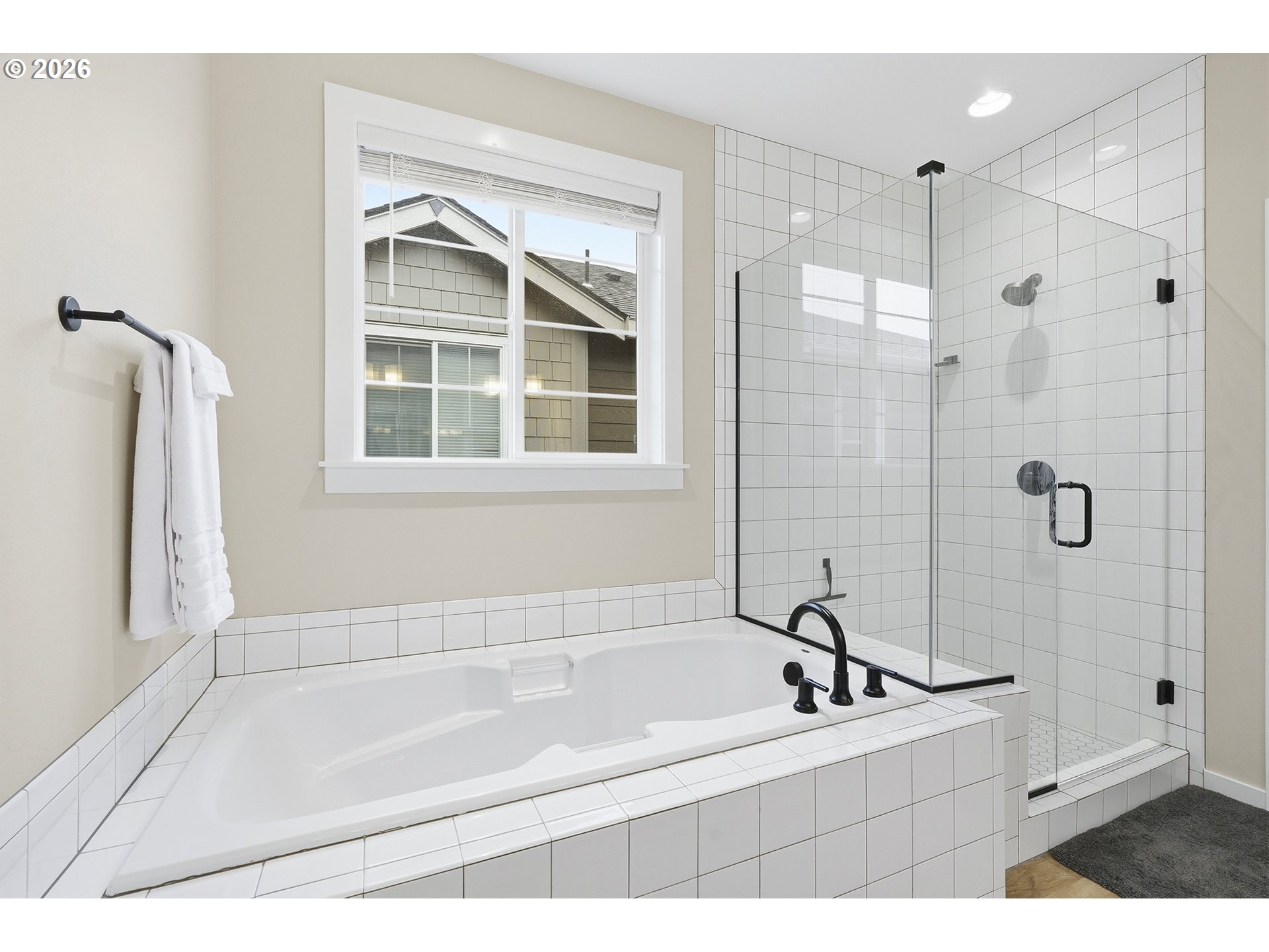 6724 Southwest Lupine Way Wilsonville, OR 97070 - Photo 36 of 45 a bathroom with a bathtub sink and mirror