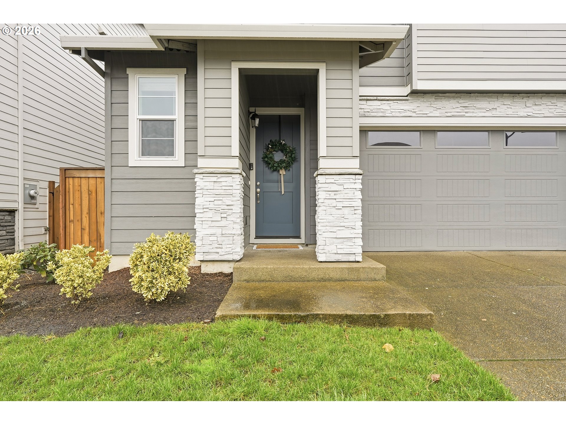 6724 Southwest Lupine Way Wilsonville, OR 97070 - Photo 5 of 45 a front view of a house with a yard