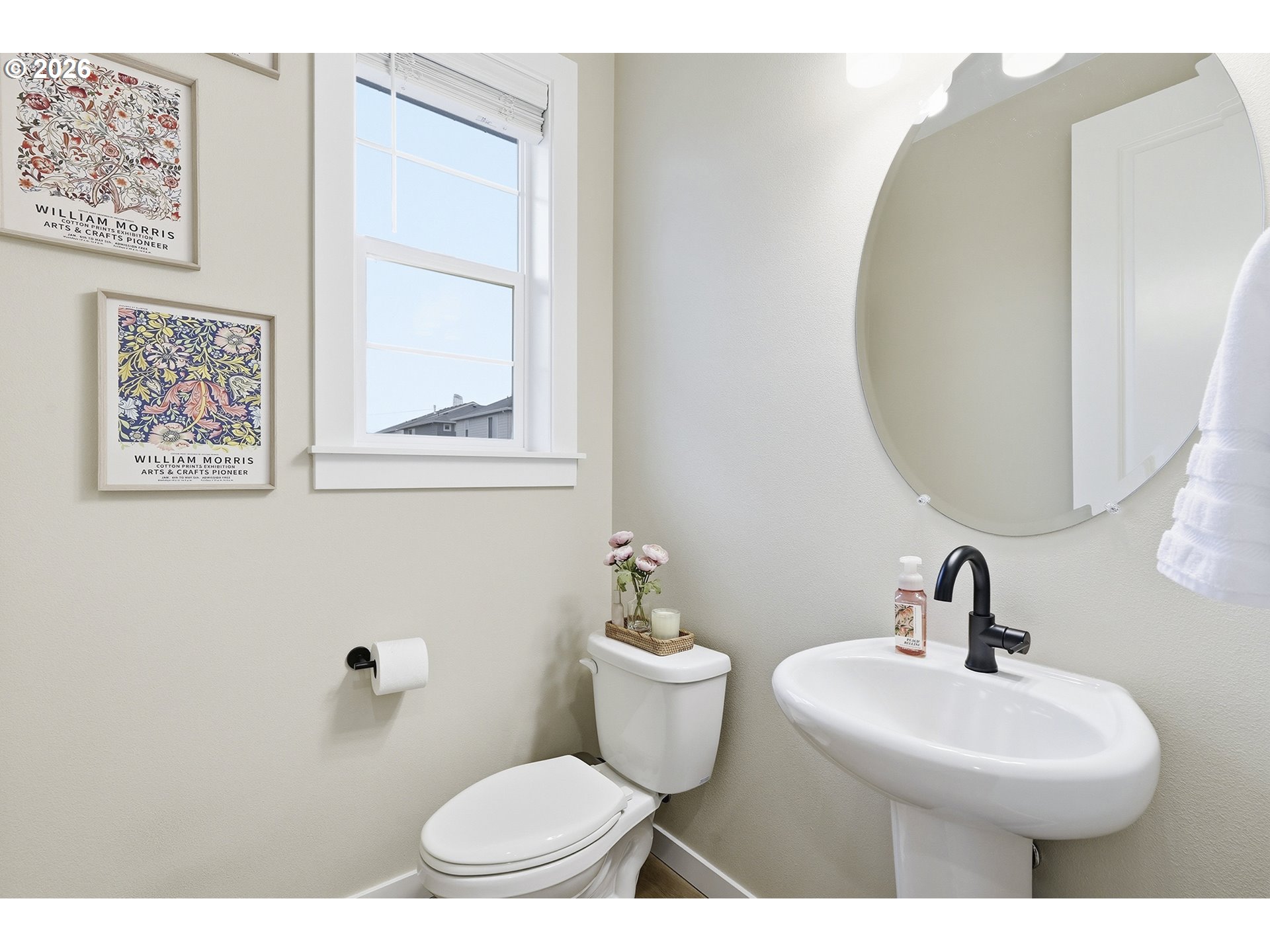 6724 Southwest Lupine Way Wilsonville, OR 97070 - Photo 8 of 45 a bathroom with a toilet a sink and mirror
