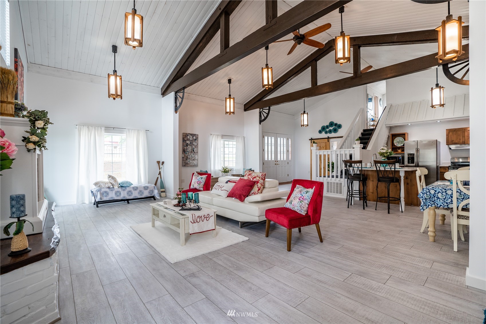 3114 Jackson Highway Chehalis, WA 98532 - Photo 16 of 40 a living room with furniture a wooden floor and a chandelier