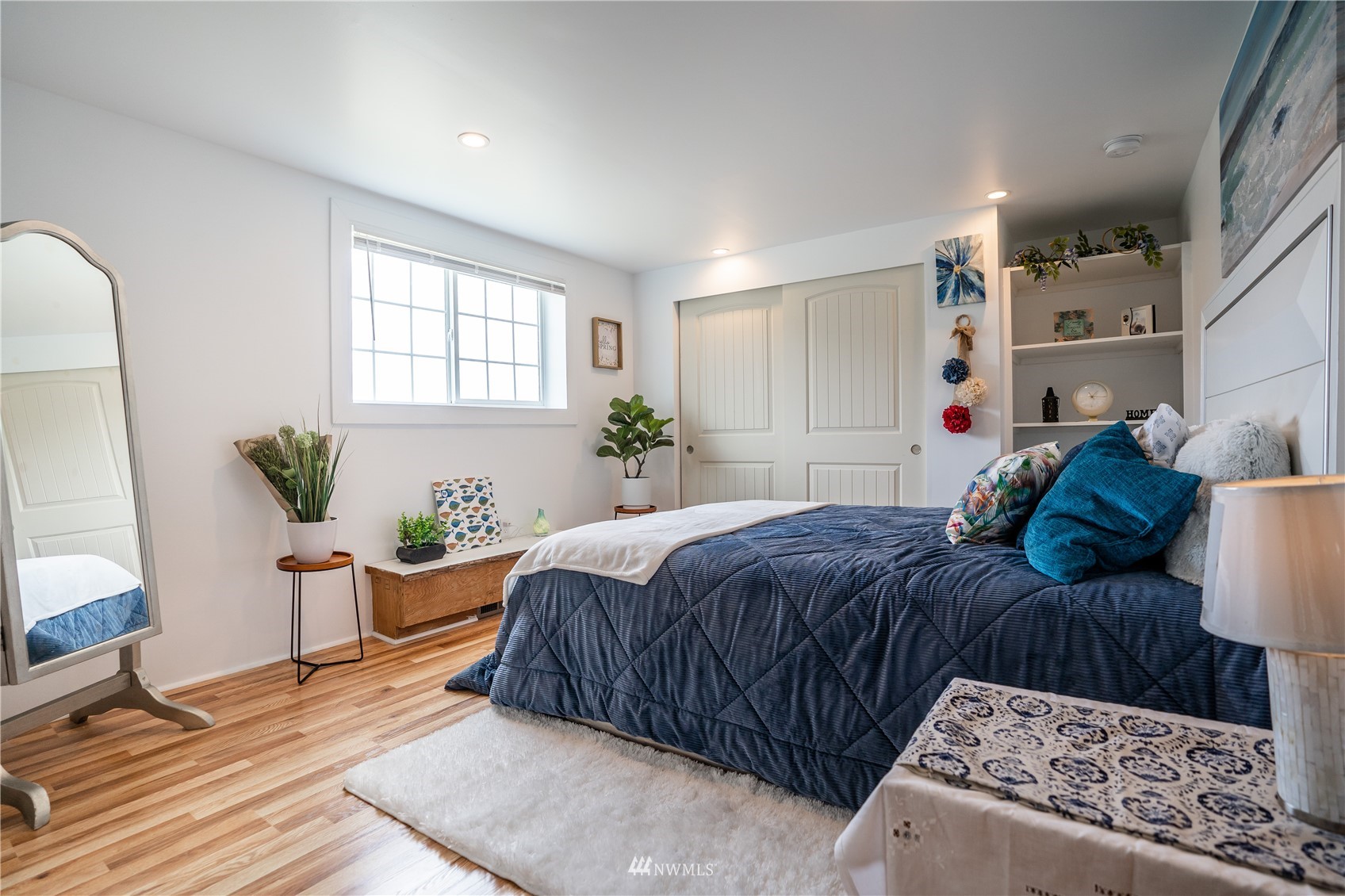 3114 Jackson Highway Chehalis, WA 98532 - Photo 29 of 40 a bedroom with a large bed and wooden floor