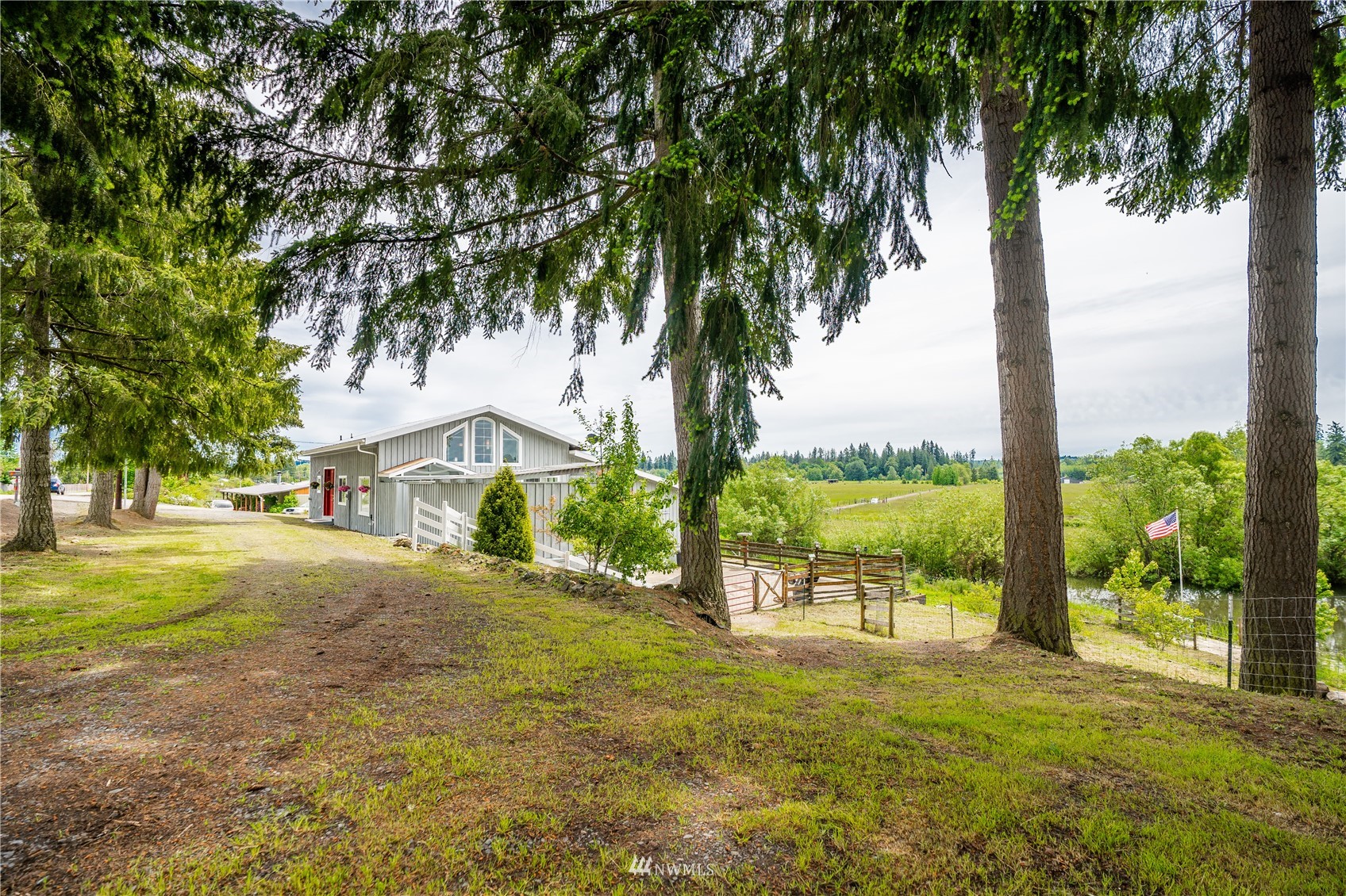 3114 Jackson Highway Chehalis, WA 98532 - Photo 38 of 40 a row of palm trees and a yard with swimming pool