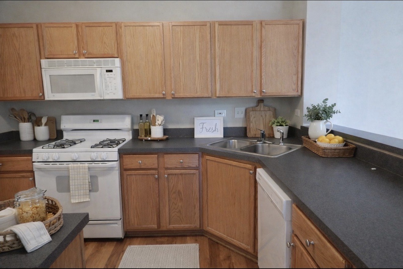 596 Foxridge Drive Fox Lake, IL 60020 - Photo 2 of 9 a kitchen with stainless steel appliances granite countertop a sink stove and cabinets
