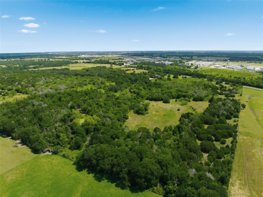 663 North Katy Road Elm Mott, TX 76640 - Photo 18 of 25 Undeveloped land featuring mature trees, open clearings, and perimeter fencing