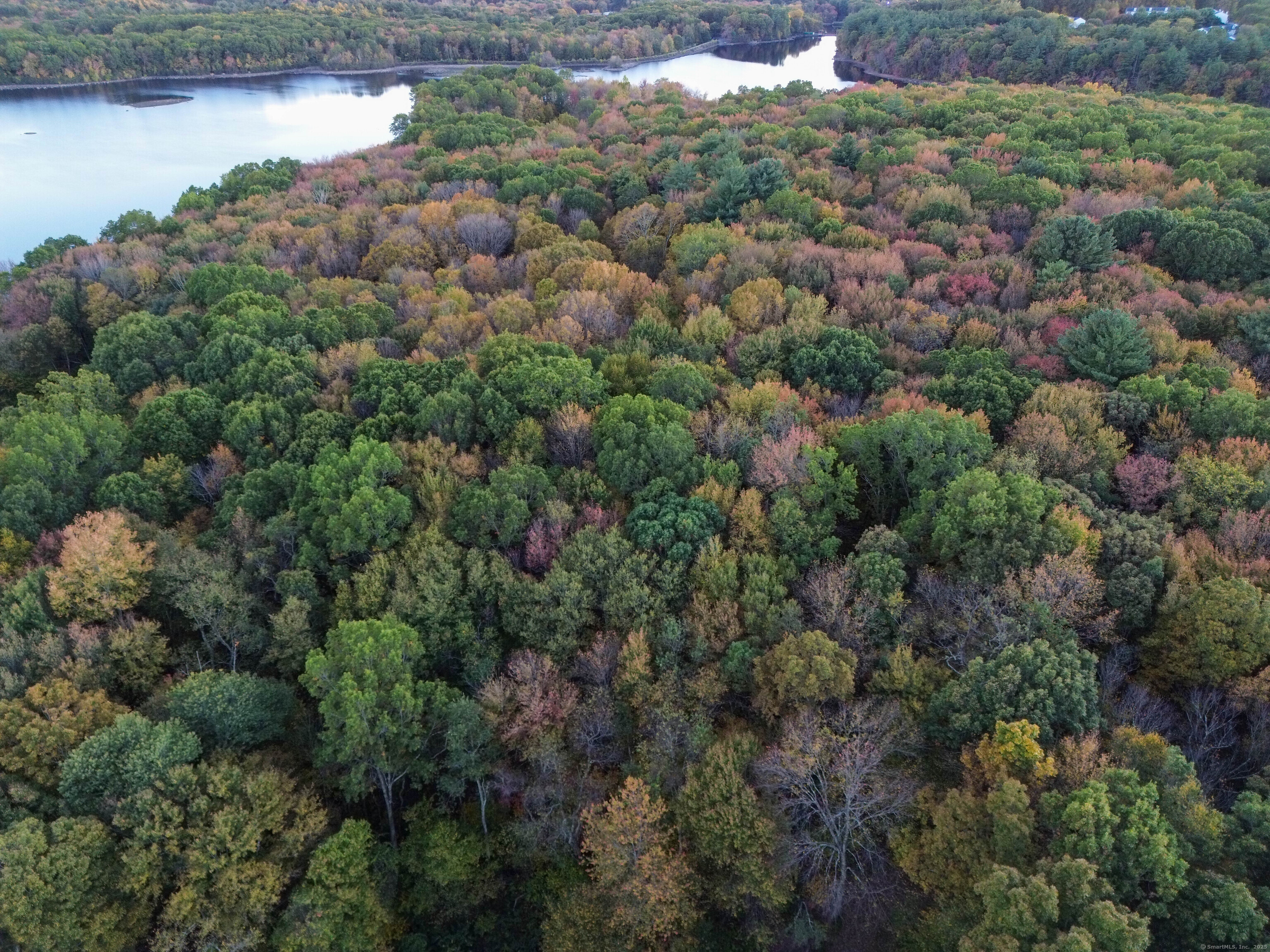 Coe Road Wolcott, CT 06716 - Photo 15 of 24 a view of a lake with top of house