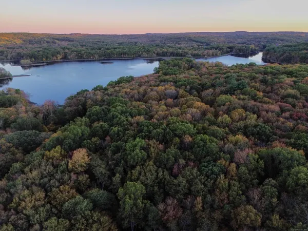 an aerial view of a houses with a lake view