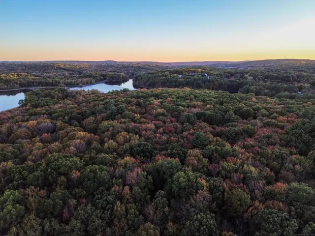 an aerial view of residential house and green space