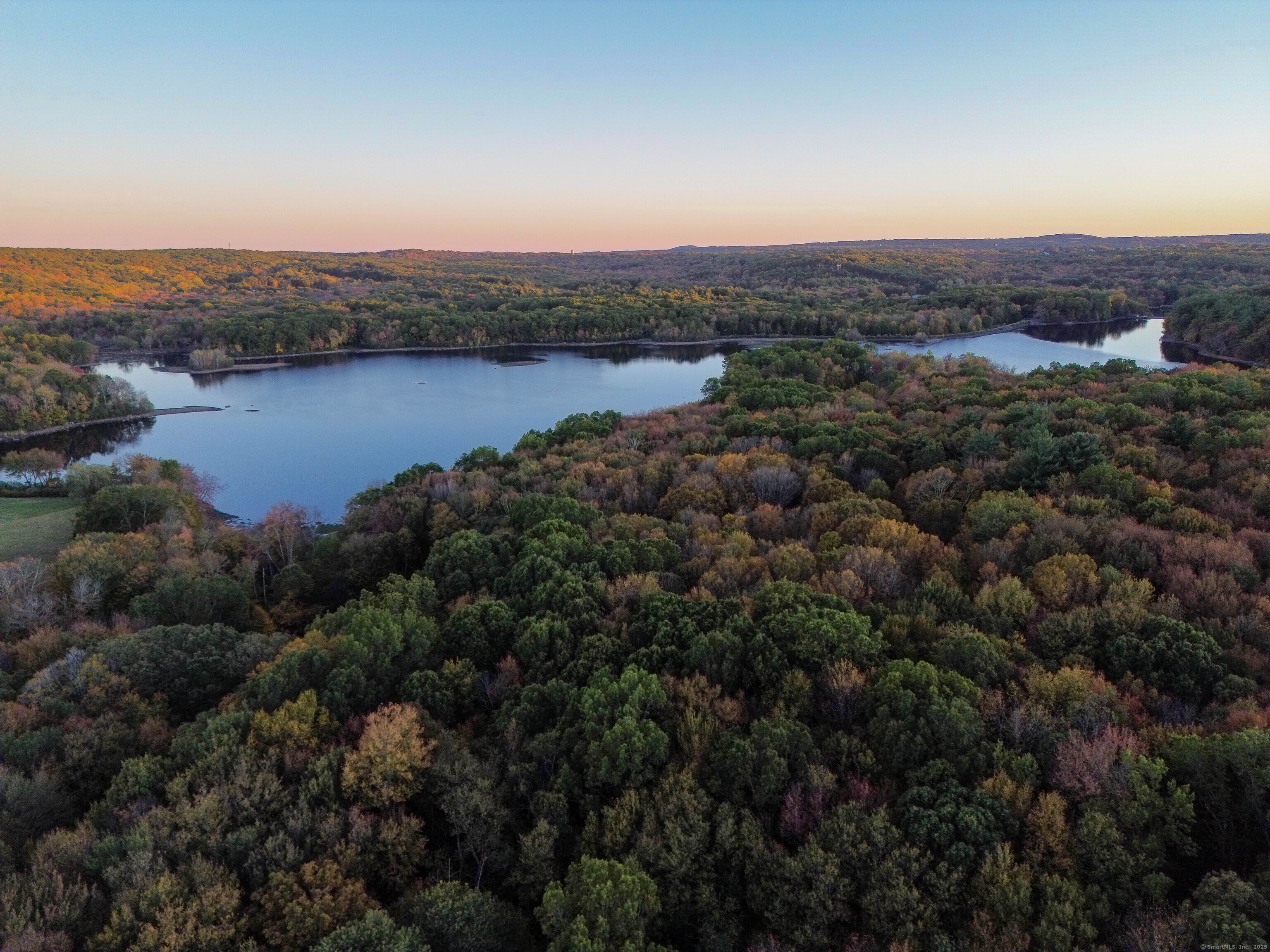 Coe Road Wolcott, CT 06716 - Photo 7 of 24 an aerial view of residential houses with outdoor space and lake view