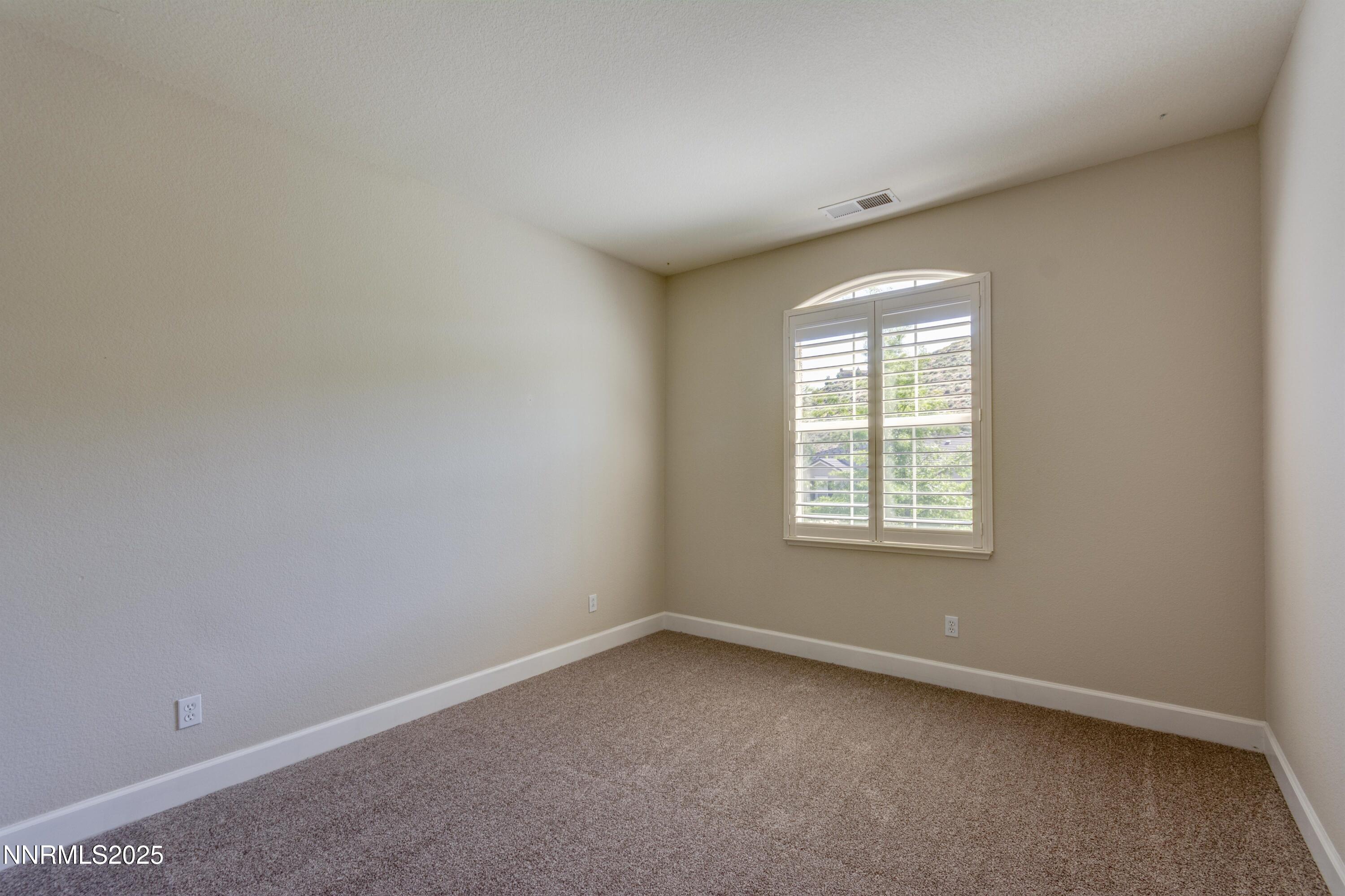 1798 Evening Rock Court Reno, NV 89523 - Photo 23 of 27 an empty room with a window
