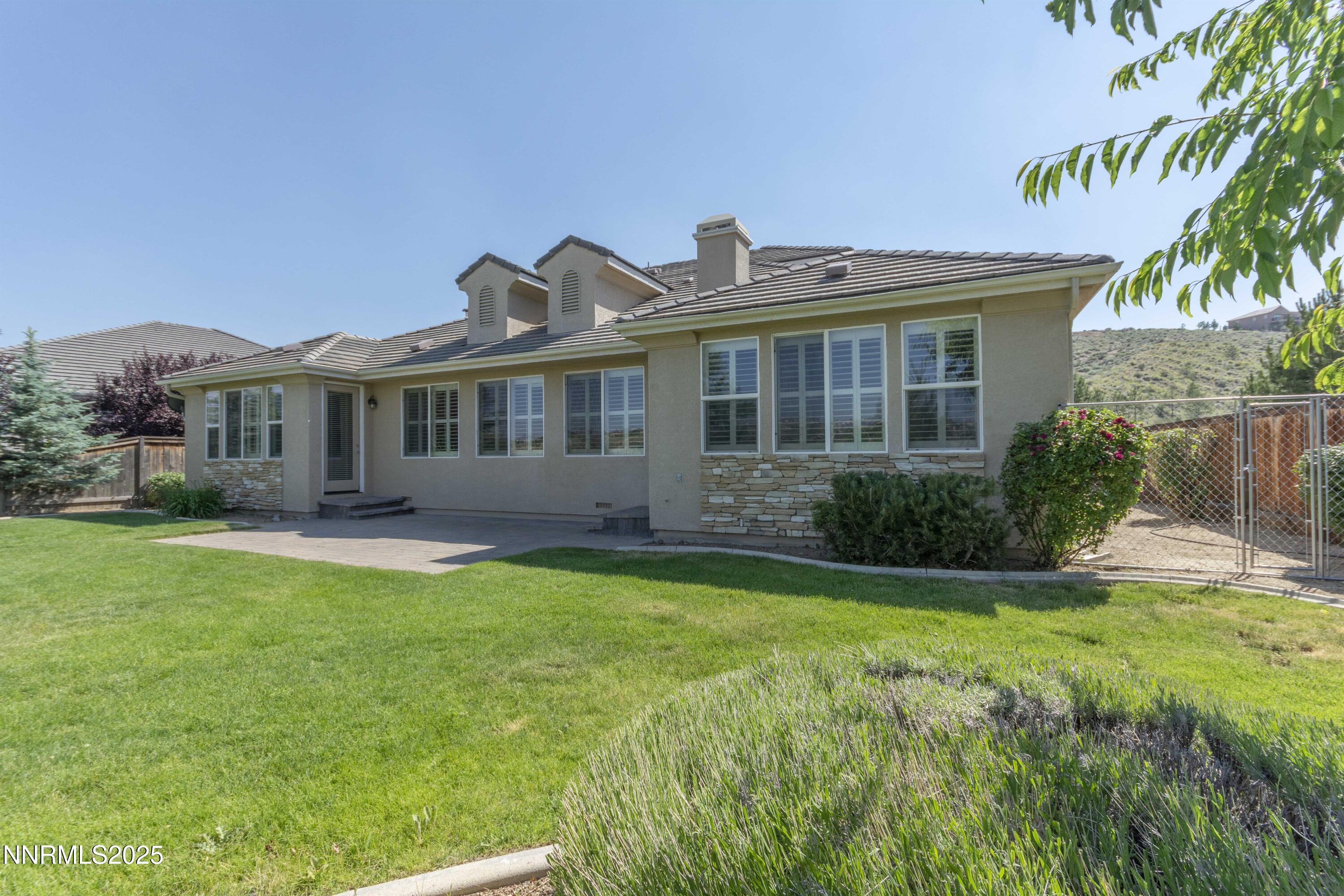 1798 Evening Rock Court Reno, NV 89523 - Photo 27 of 27 a view of a house with a yard and potted plants