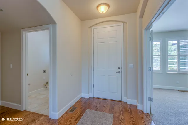 a view of room with window and hardwood floor