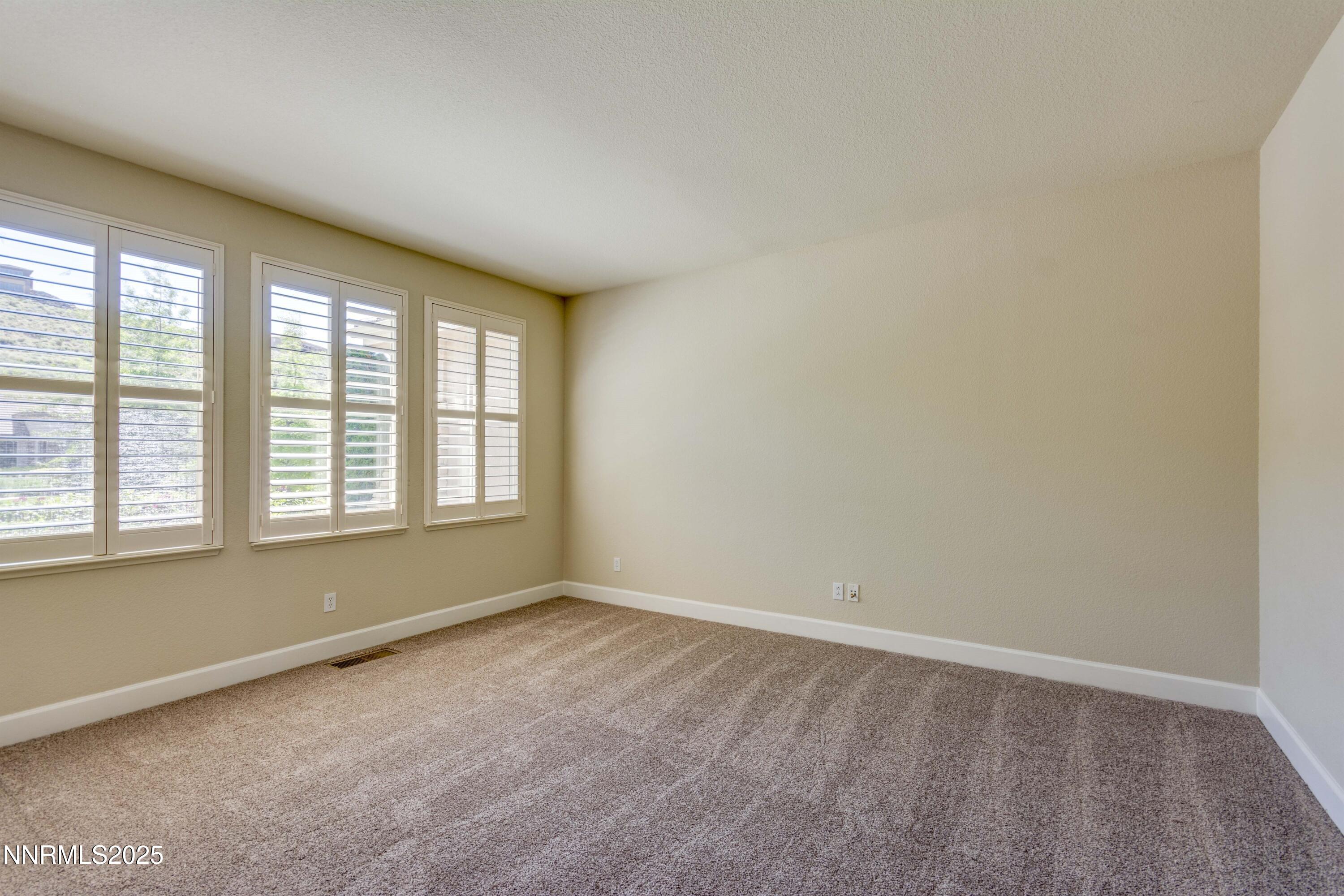 1798 Evening Rock Court Reno, NV 89523 - Photo 5 of 27 an empty room with a window