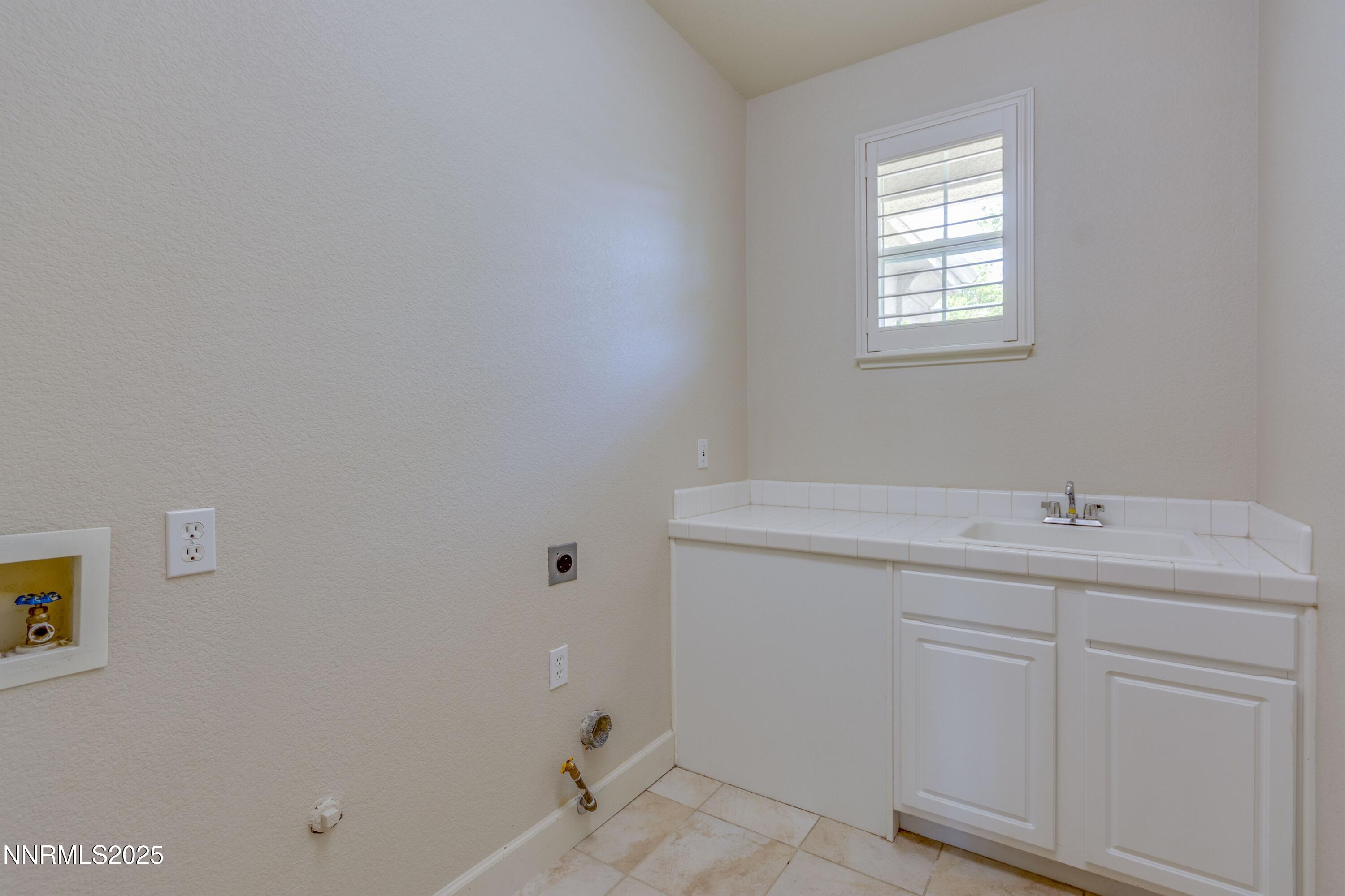 1798 Evening Rock Court Reno, NV 89523 - Photo 6 of 27 a bathroom with a sink and a vanity