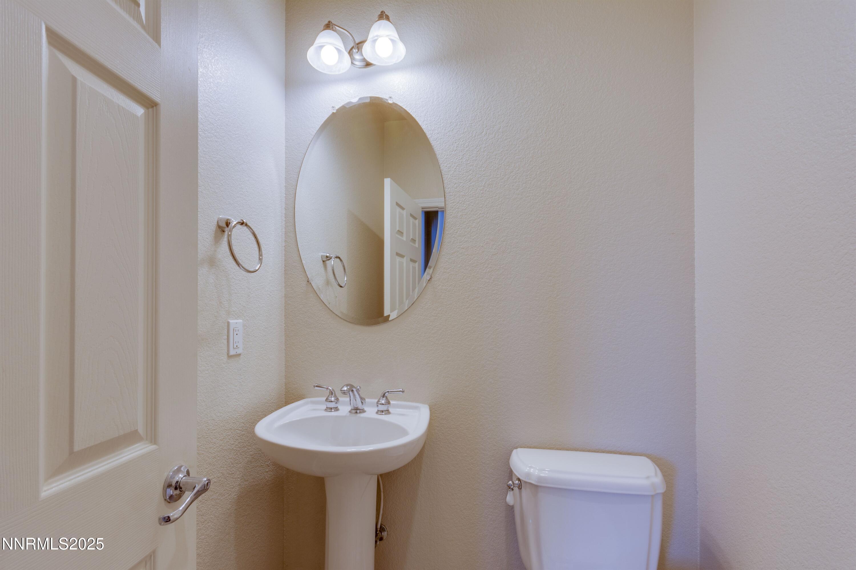 1798 Evening Rock Court Reno, NV 89523 - Photo 7 of 27 a bathroom with a sink and mirror
