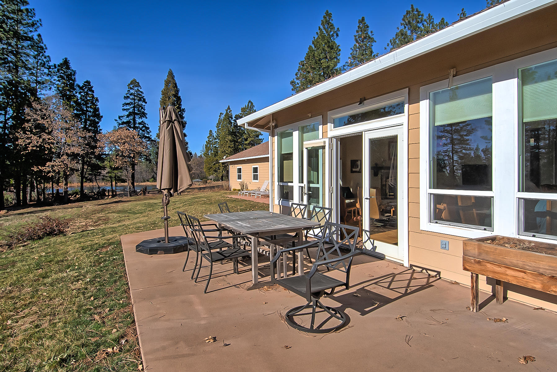 32505 Forwards Ml Road Manton, CA 96059 - Photo 19 of 70 a view of a patio with table and chairs and potted plants
