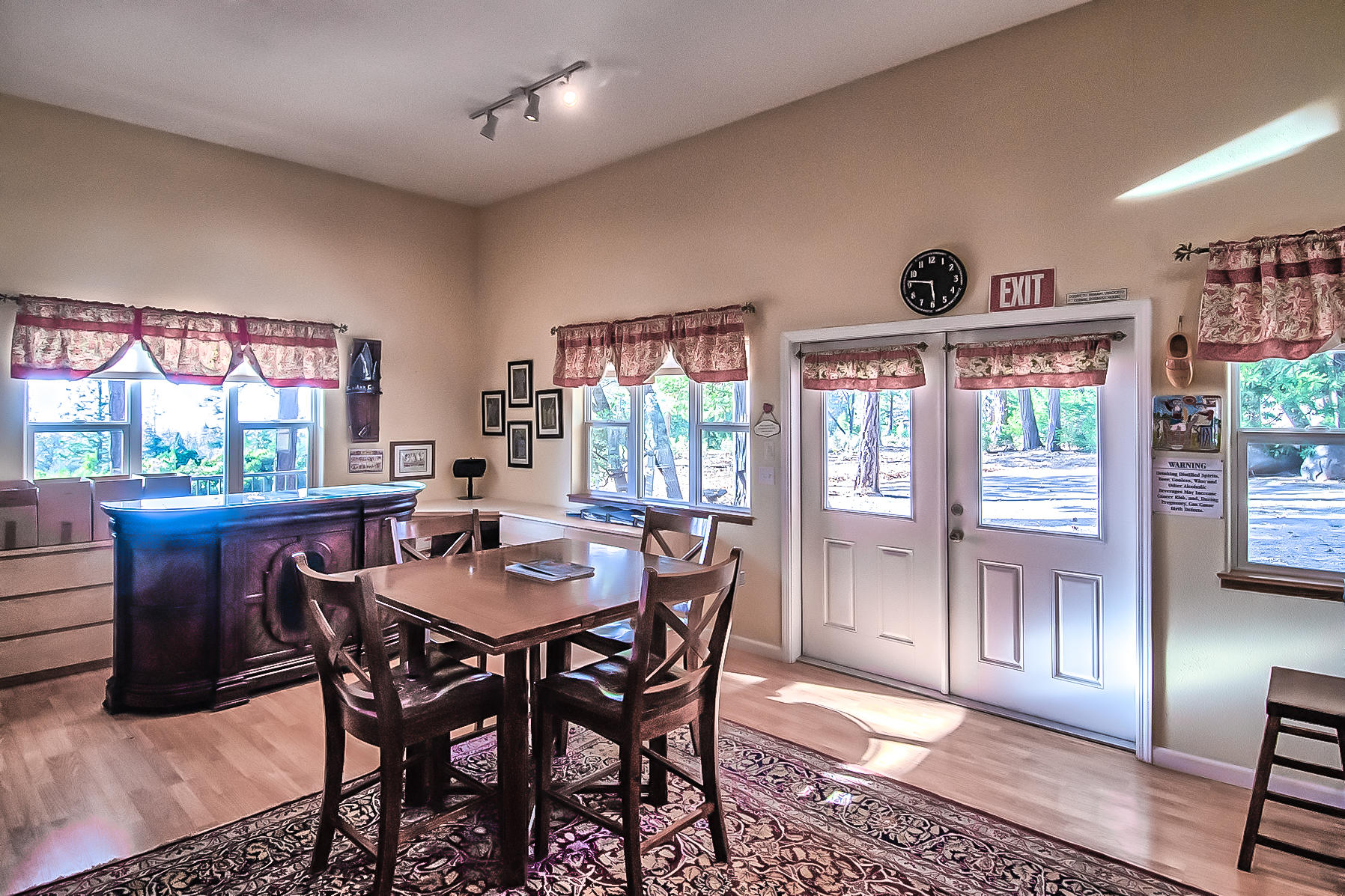 32505 Forwards Ml Road Manton, CA 96059 - Photo 21 of 70 a dining room with furniture a rug and a floor to ceiling window