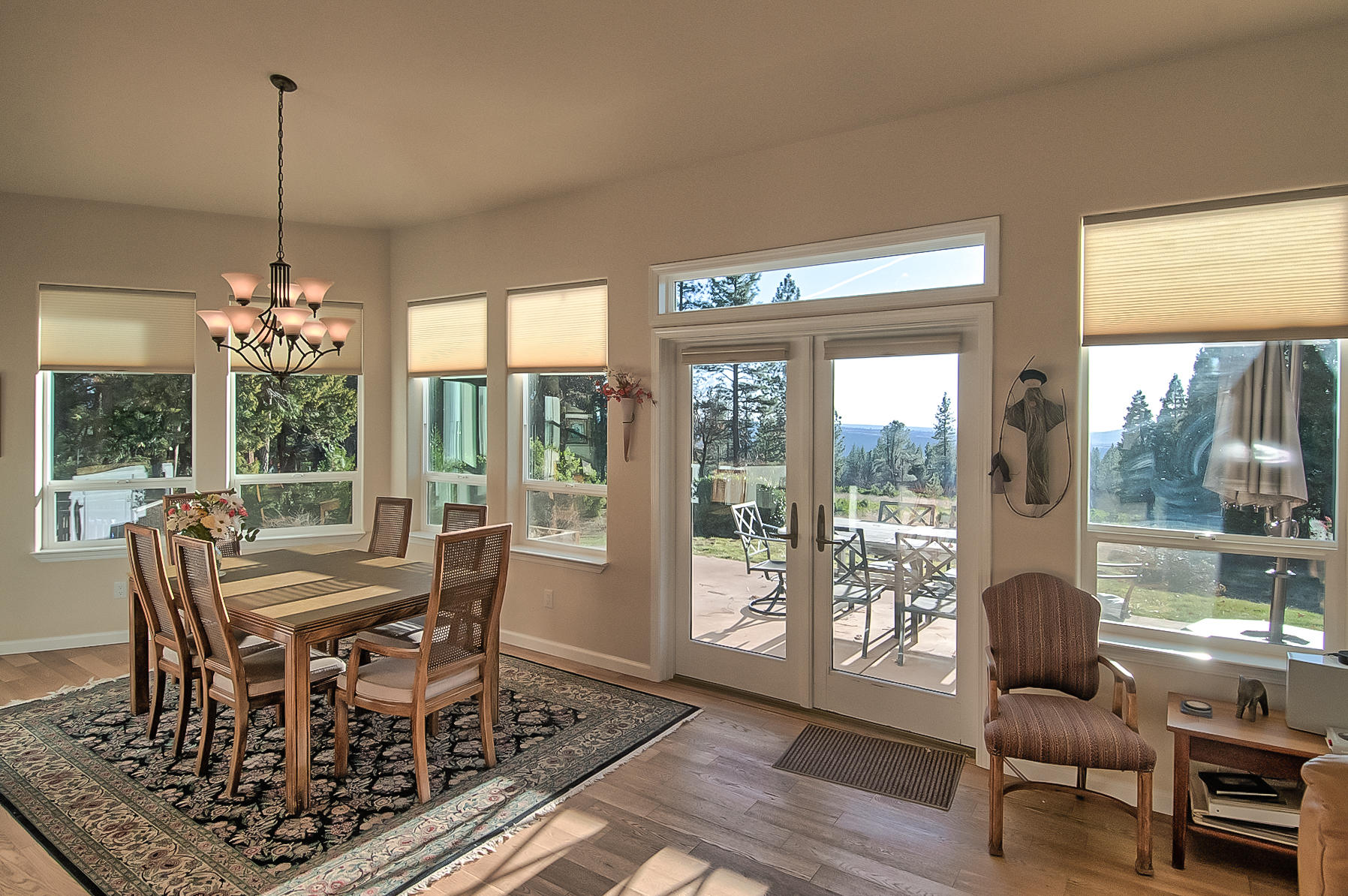 32505 Forwards Ml Road Manton, CA 96059 - Photo 39 of 70 a view of a dining room with furniture wooden floor and a chandelier